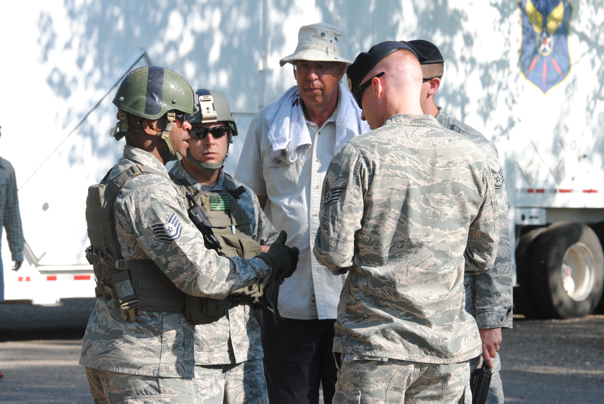 Tech Sgt. Billy Gaines, 741st Missile Security Forces Squadron convoy response force member, far left, discusses his role in a training exercise to other participants in a first-of-its-kind shoot/don’t shoot exercise. Gaines was one of more than 60 members representing the 741st MSFS, 341st Security Support Squadron and 341st Maintenance Group who participated in the three-day production. (U.S. Air Force photo/Airman 1st Class Katrina Heikkinen)