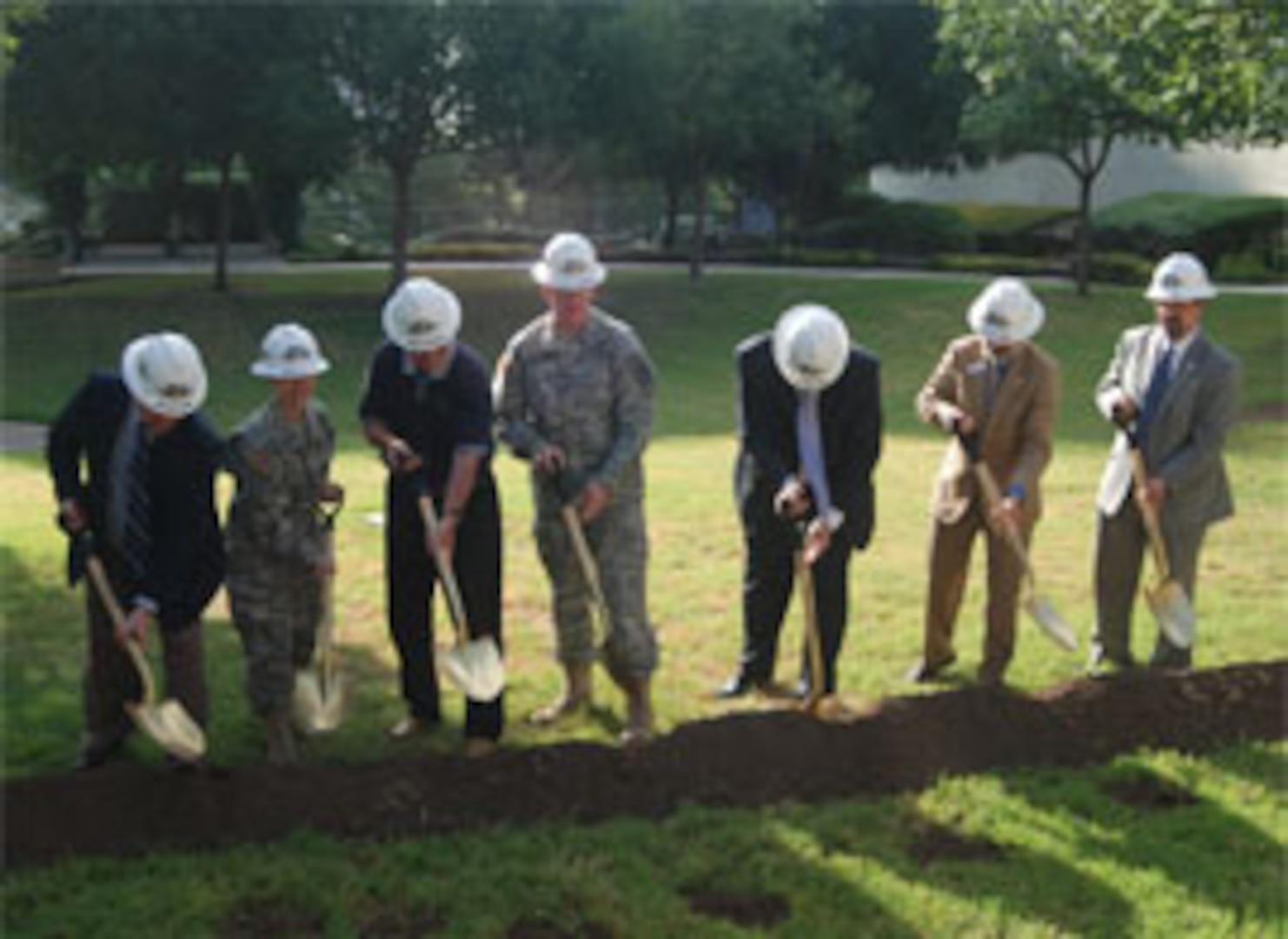 (From left) Scott Schoner, Col. Mary Garr, retired Maj. Gen Patrick Brady, Lt. Gen. Eric Schoomaker, retired Maj. Gen. Patrick Sculley, retired Maj. Gen. Kenneth Farmer and Marc Long celebrate the groundbreaking for the Army
Medical Department Museum Foundation's $1.3 million Medal of Honor Walk addition to the museum grounds. Construction will start this fall.