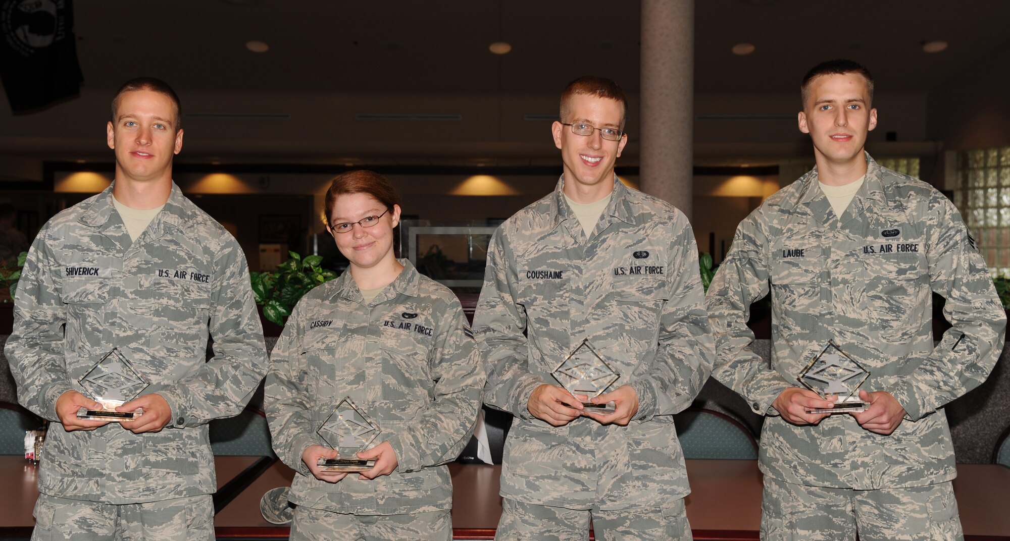 July’s Diamond Sharp Award recipients at Grand Forks Air Force Base, N.D., are (from left ): Airman 1st Class Alexander Shiverick, 319th Civil Engineer Squadron; Airman 1st Class Vivienne Cassidy, Logistics Readiness Squadron; Airman 1st Class Charles Coushaine, IV, Force Support Squadron; and Senior Airman Ryan Laube, Communications Squadron.  (U.S. Air Force photo by Airman 1st Class Xavier Navarro)