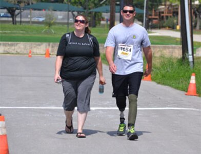 Sgt. Daniel Burgess and his wife, Genette, on a 2-mile run/walk event during the Mini-Try held at Joint Base San Antonio Fort Sam Houston May 18.  (Photo by Robert D'Angelo)


