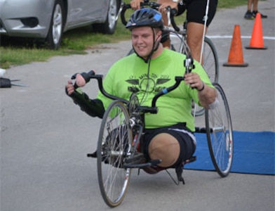 Spc. Jack Zimmerman in the 10-mile bicycle coursein the Mini-Try held at Joint Base San Antonio Fort Sam Houston May 18.  (Photo by Maria Gallegos)