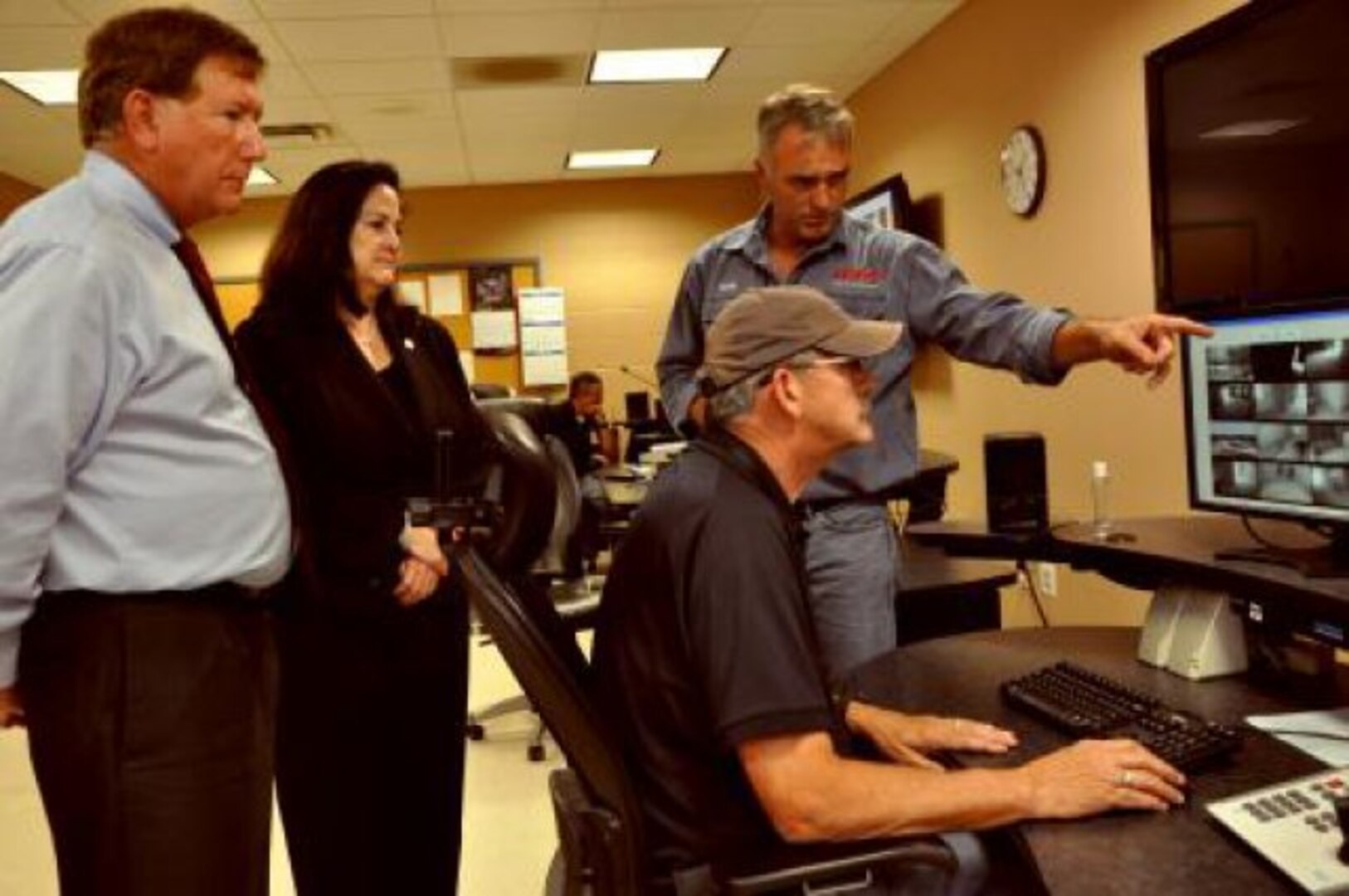 Terry Yonkers (left), assistant secretary of the Air Force for installations, environment and logistics and Katherine Hammack, assistant secretary of the Army for installations, energy and environment, talk with Bobby Clark (right), the San Antonio area manager for the Combined Arms Collective Training Facility at Camp Bullis May 22. Greg Nix, an electronics technician with the CACTF, sits at the computer. Yonkers and Hammack came to Joint Base San Antonio May 21-22 to examine and discuss energy-saving construction initiatives for their respective services and tour facilities on Fort Sam Houston and Camp Bullis. The CACTF provides realistic urban operations training.
(U.S. Army photo Leslie Shively)