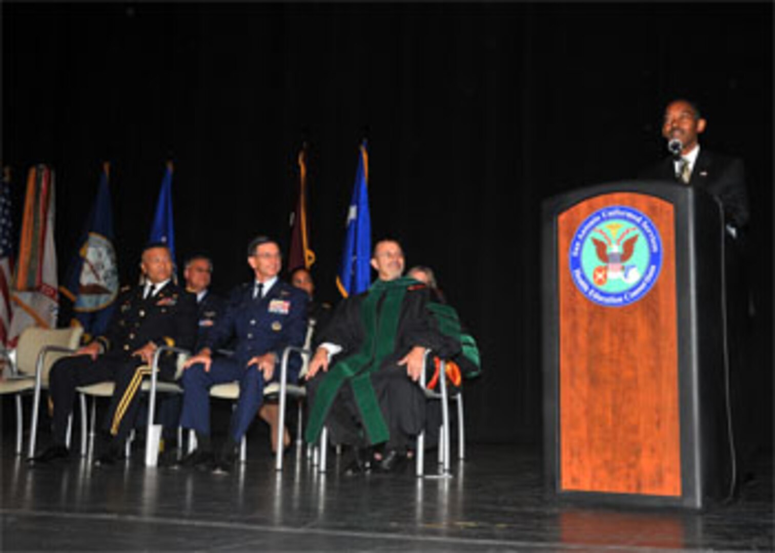 Dr. Jonathan Woodson, assistant secretary of Defense for Health Affairs and director, TRICARE Management Activity, gave the keynote address to the recent graduates of the San Antonio Uniformed Services Health Education Consortium June 8. (Courtesy Photo by SAUSHEC)