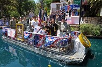 Lt. Gen. William Caldwell IV, commanding general, U.S. Army North, and senior commander, Fort Sam Houston and Camp Bullis, waves to spectators May 19 as Grand Marshal of the "Here's to our Heroes" Military River Parade. The inaugural parade opened at the Arneson River Theater and featured 25 river floats, representing all branches of the military, veterans, military support groups and more, in honor of Armed Forces Day. 
(U.S. Army photo by Staff Sgt. Keith Anderson)