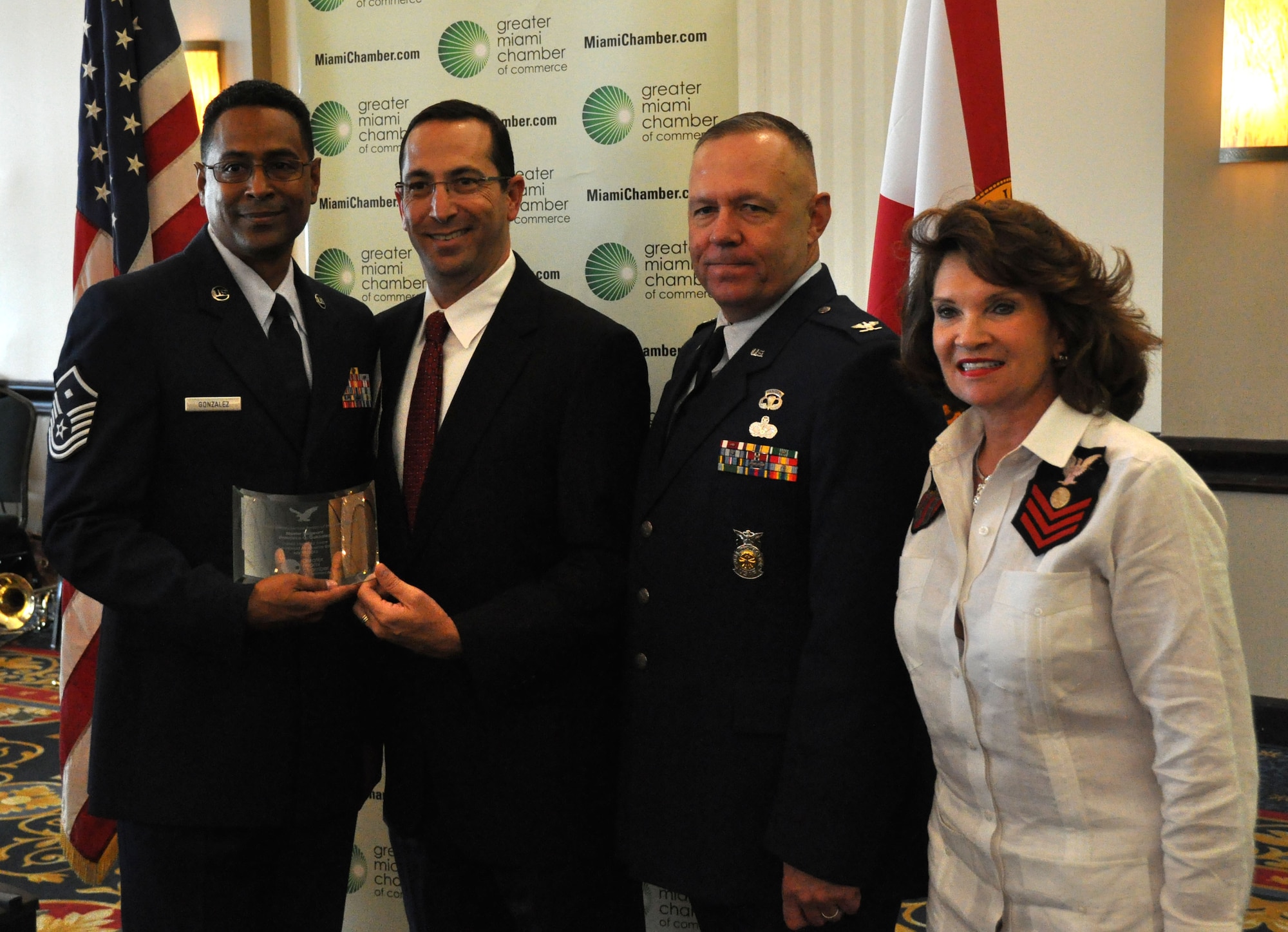 From left: Master Sergeant Francisco Gonzalez, 482nd Force Support Squadron first sergeant, Doug Bartel, Florida Blue director of business development, Col. Elwin A. Rozyskie Jr., 482nd Mission Support Group commander, and Phillis Oeters, Greater Miami Chamber of Commerce chair and Baptist Health South Florida corporate vice president, government and community relations at the 25th Annual Military Service Person of the Year Awards at Jungle Island in Miami, July 11. Members of the Greater Miami Chamber of Commerce honored Master Sergeant Francisco Gonzalez by naming him a Person of the Year for the Air Force. (U.S. Air Force photo/Ross Tweten)