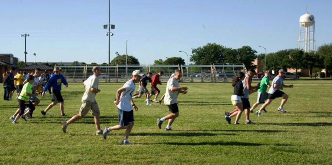 Teams take off after receiving their first clue in Sheppard’s “Race 2 Awareness” run on April 21. This was an 'Amazing Race' type event where teams of two ran to different agencies on base to get clues that would lead them to their next obstacle. The SARC Office participated as one of the sponsors of the race. (U.S. Air Force/Courtesy Photo)