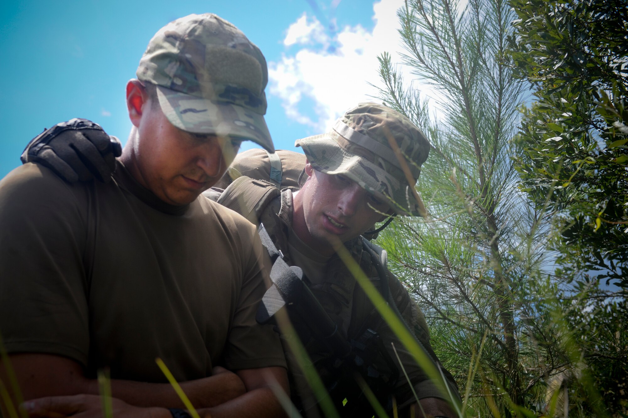 U.S. Air Force Staff Sgt. Kenneth O’Brien, 38th Rescue Squadron pararescueman, comforts 1st Lt. Daniel Fischer, 38th RQS intelligence officer, during a training scenario at Moody Air Force Base, Ga., July 16, 2012. O’Brien ensured Fischer remained calm as the evacuation team moved toward their location. (U.S. Air Force photo by Airman 1st Class Douglas Ellis/Released)

