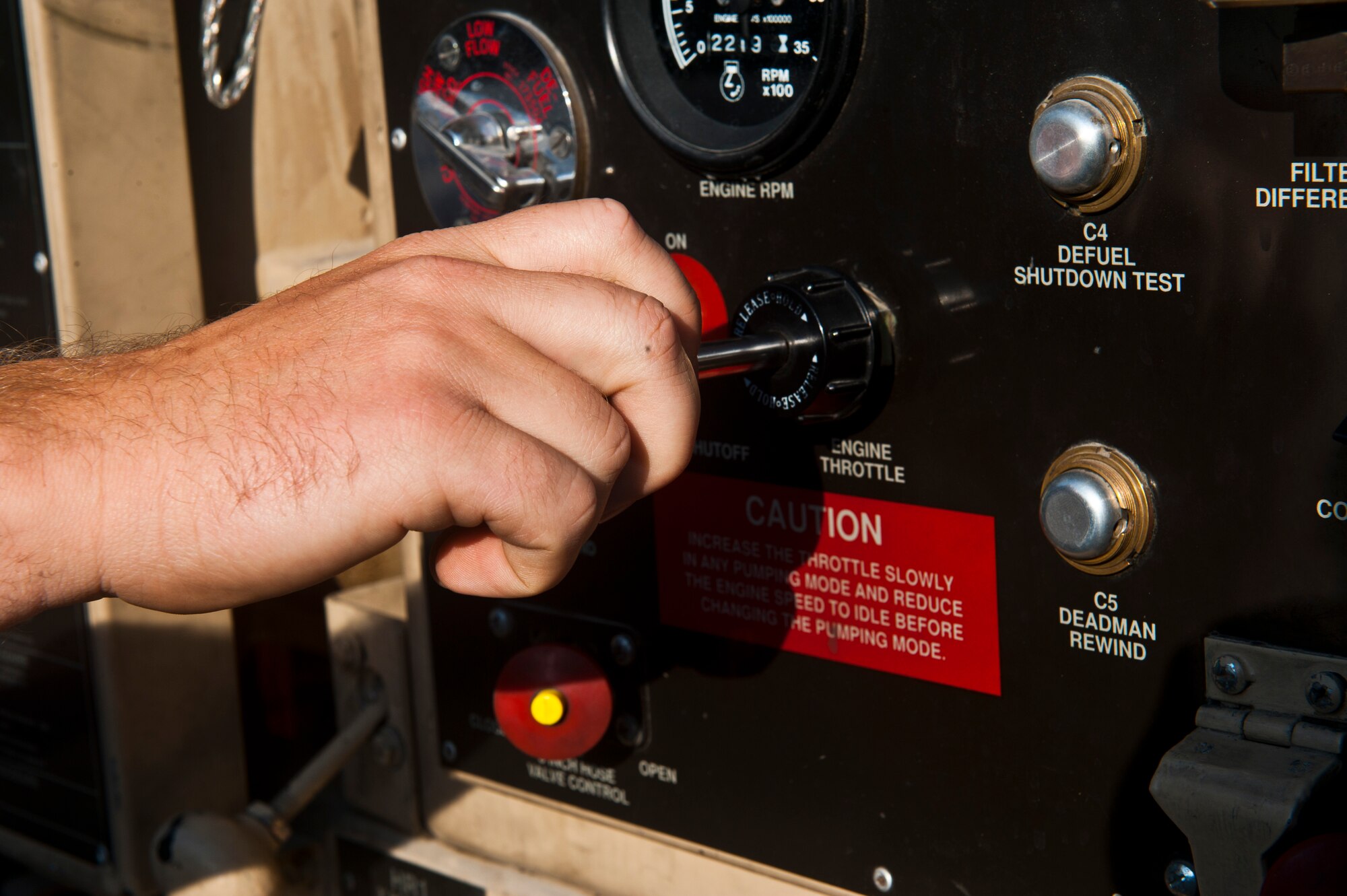 Senior Airman Zach Conoway adjusts the fuel pressure flow on a R-11 fuel truck at the Transit Center at Manas, Kyrgyzstan, July 18, 2012. A R-11 fuel truck can carry up to 8,000 gallons of fuel. Conoway is a 376th Expeditionary Logistics Readiness Squadron fuels distribution journeyman deployed from Joint Base McGuire-Dix-Lakehurst, N.J. and is a native of Loganton, Pa. (U.S. Air Force photo/Senior Airman Brett Clashman)