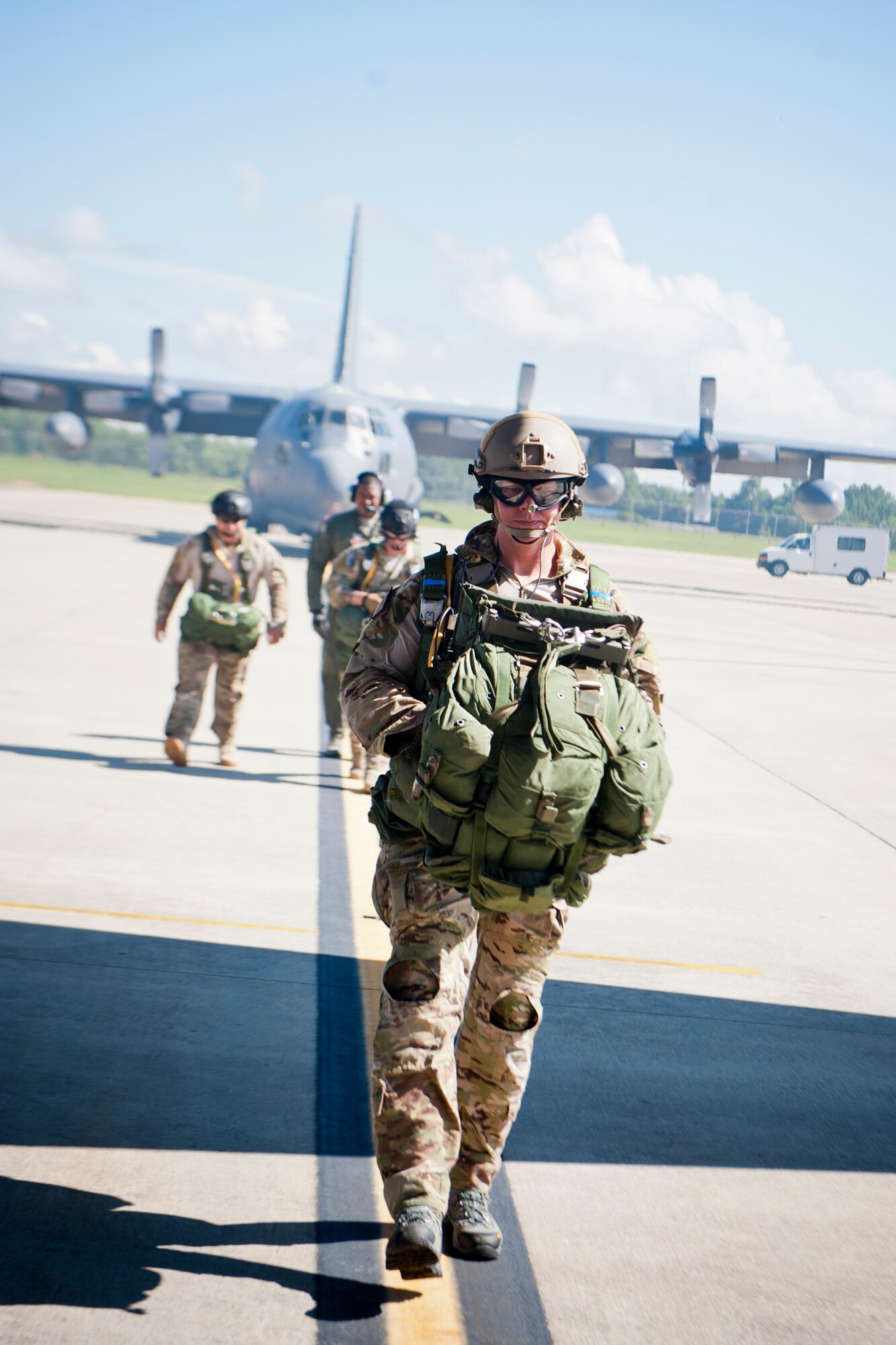 U.S. Air Force Maj. Matthew Bury, a combat rescue officer currently assigned to the 23d Wing Plans, Programs and Inspections office, approaches an HC-130P Combat King July 16, 2012, at Moody Air Force Base, Ga. Bury participated in a static line jump with 38th Rescue Squadron Airmen to remain proficient at his CRO duties. (U.S. Air Force photo by Staff Sgt. Jamal D. Sutter/Released)