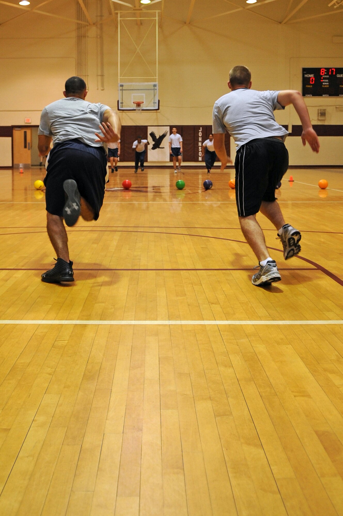 U.S. Air Force Airmen assigned to the 4th Equipment Maintenance Squadron run toward the center of the court during the Friday the 13th dodge ball tournament on Seymour Johnson Air Force Base, N.C., July 13, 2012. The tournament was an opportunity for Airmen to participate in a friendly competition against other squadron teams. (U.S. Air Force photo/Airman 1st Class Aubrey Robinson/Released)