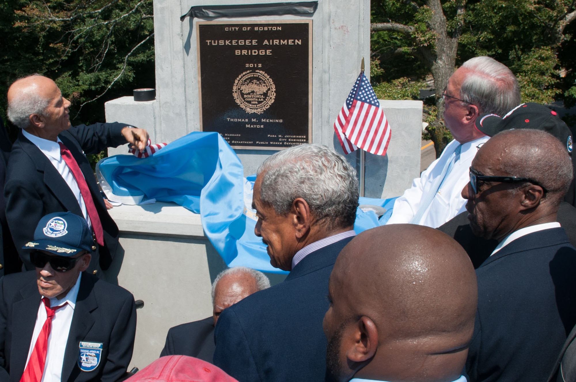 BOSTON - Mayor Thomas Menino (back row, right) and members of the Tuskegee Airmen unveil a plaque dedicating a bridge on the American Legion Highway as the Tuskegee Airmen Bridge on July 17. Members of the Boys & Girls Club of Boston decided to name the bridge in honor of the World War II heroes. (U.S. Air Force photo by Rick Berry)