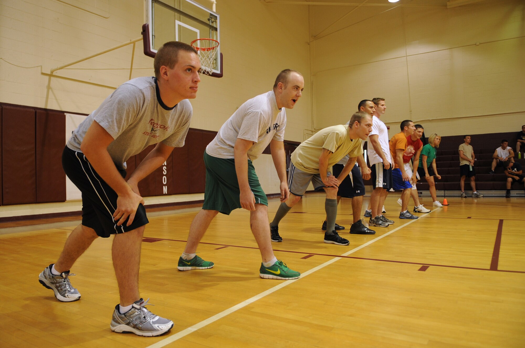 U.S. Air Force Airmen assigned to the 4th Civil Engineer Squadron prepare for a match during the Friday the 13th dodge ball tournament on Seymour Johnson Air Force Base, N.C., July 13, 2012. Airmen represented their respective squadrons in teams of eight and competed during 10-minute matches. (U.S. Air Force photo/Airman 1st Class Aubrey Robinson/Released)