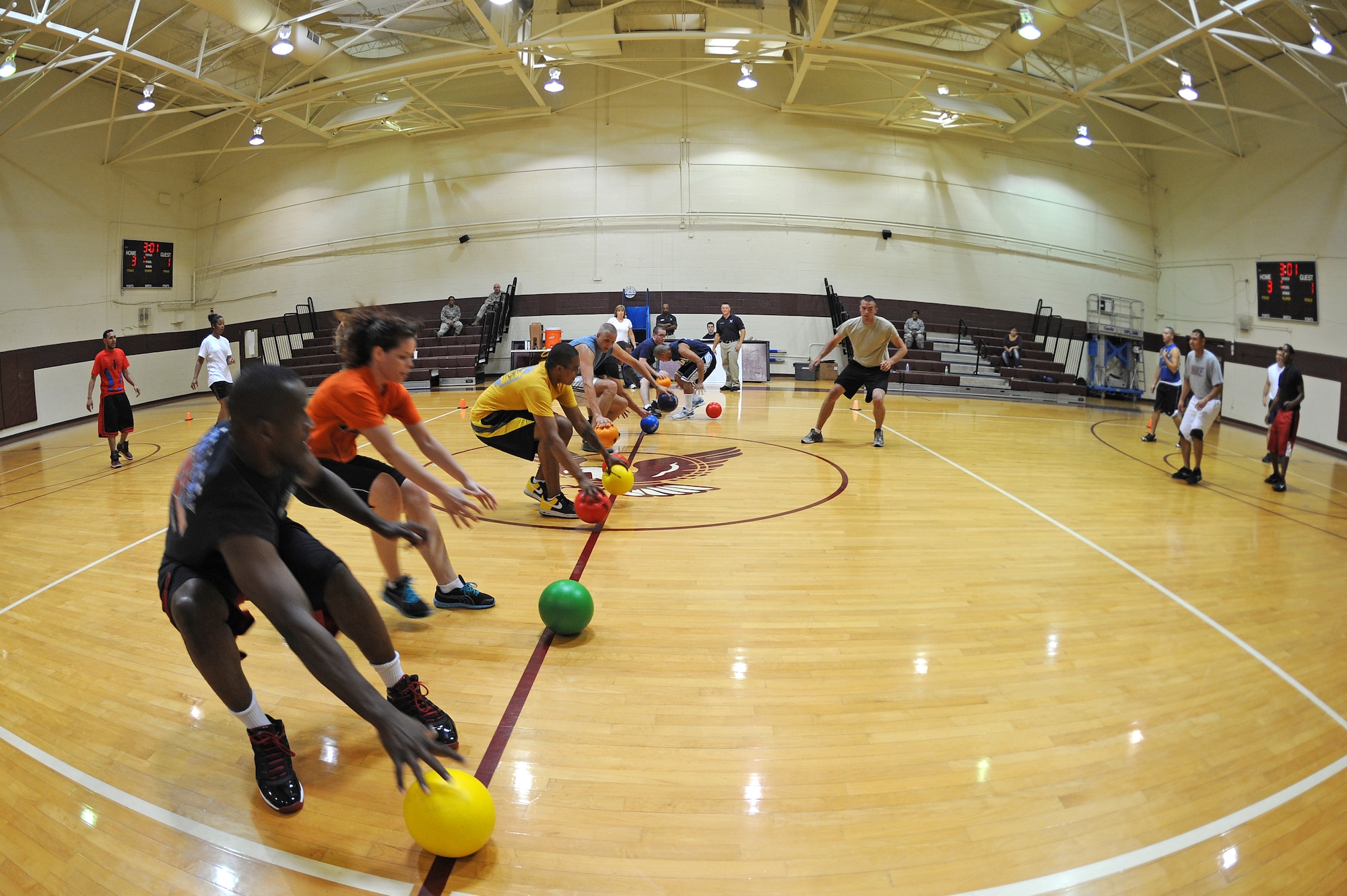 U.S. Air Force Airmen assigned to the 4th Comptroller Squadron prepare to play during the Friday the 13th dodge ball tournament on Seymour Johnson Air Force Base, N.C., July 13, 2012. The tournament was open to any squadron team and hosted by members of the 4th Force Support Squadron. (U.S. Air Force photo/Airman 1st Class Aubrey Robinson/Released)