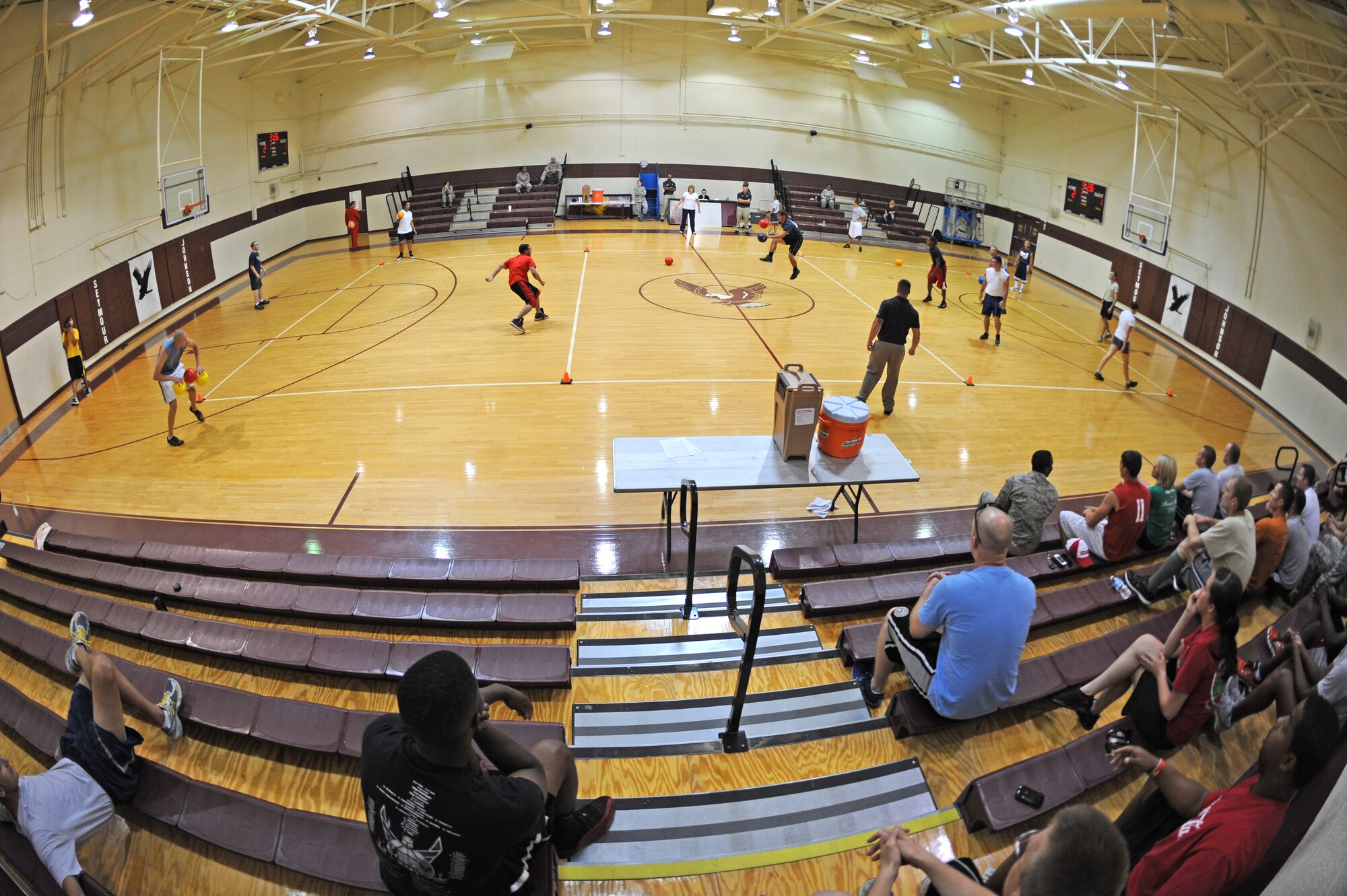 U.S. Air Force Airmen from the 4th Comptroller and Equipment Maintenance Squadrons compete during the Friday the 13th dodge ball tournament on Seymour Johnson Air Force Base, N.C., July 13, 2012. The Airmen were able to come together to practice teamwork and built camaraderie while taking a break from their work. (U.S. Air Force photo/Airman 1st Class Aubrey Robinson/Released)