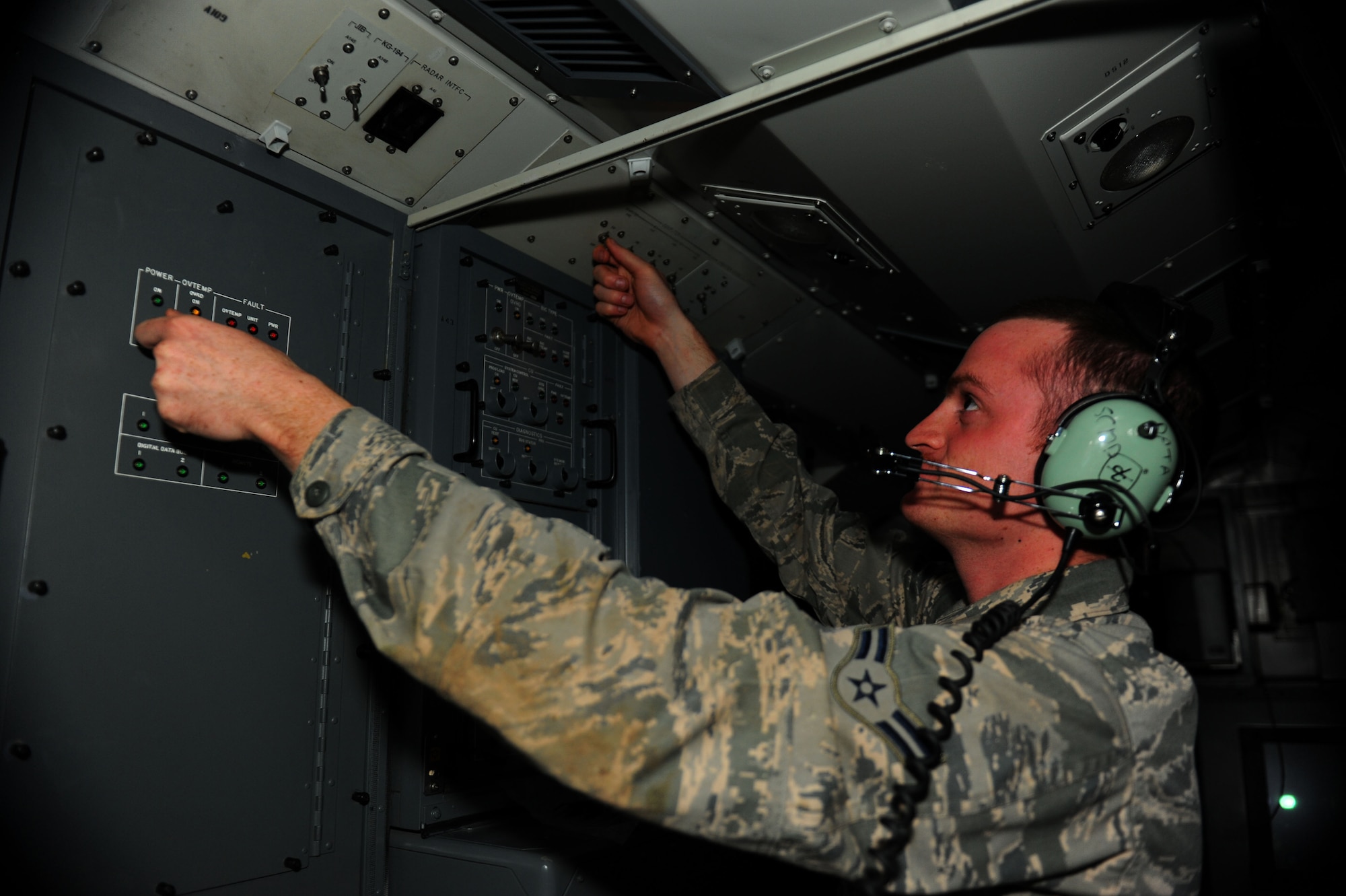 GEROLSTEIN, Germany – Airman 1st Class James Lingenfeter, 606th Air Control Squadron surveillance technician, makes checks inside a tactical operations module for Eifel Strike 2012 here July 16.  Eifel Strike is an annual field training exercise during which Airmen build a controlled radar site as well as a control and reporting center to work and live out of for a week. Exercises like this are designed to give Spangdahlem Airmen the practice, skills and experience they need to deploy efficiently and effectively within a moment’s notice in support of contingency operations around the world. (U.S. Air Force photo by Airman 1st Class Gustavo Castillo/Released) 