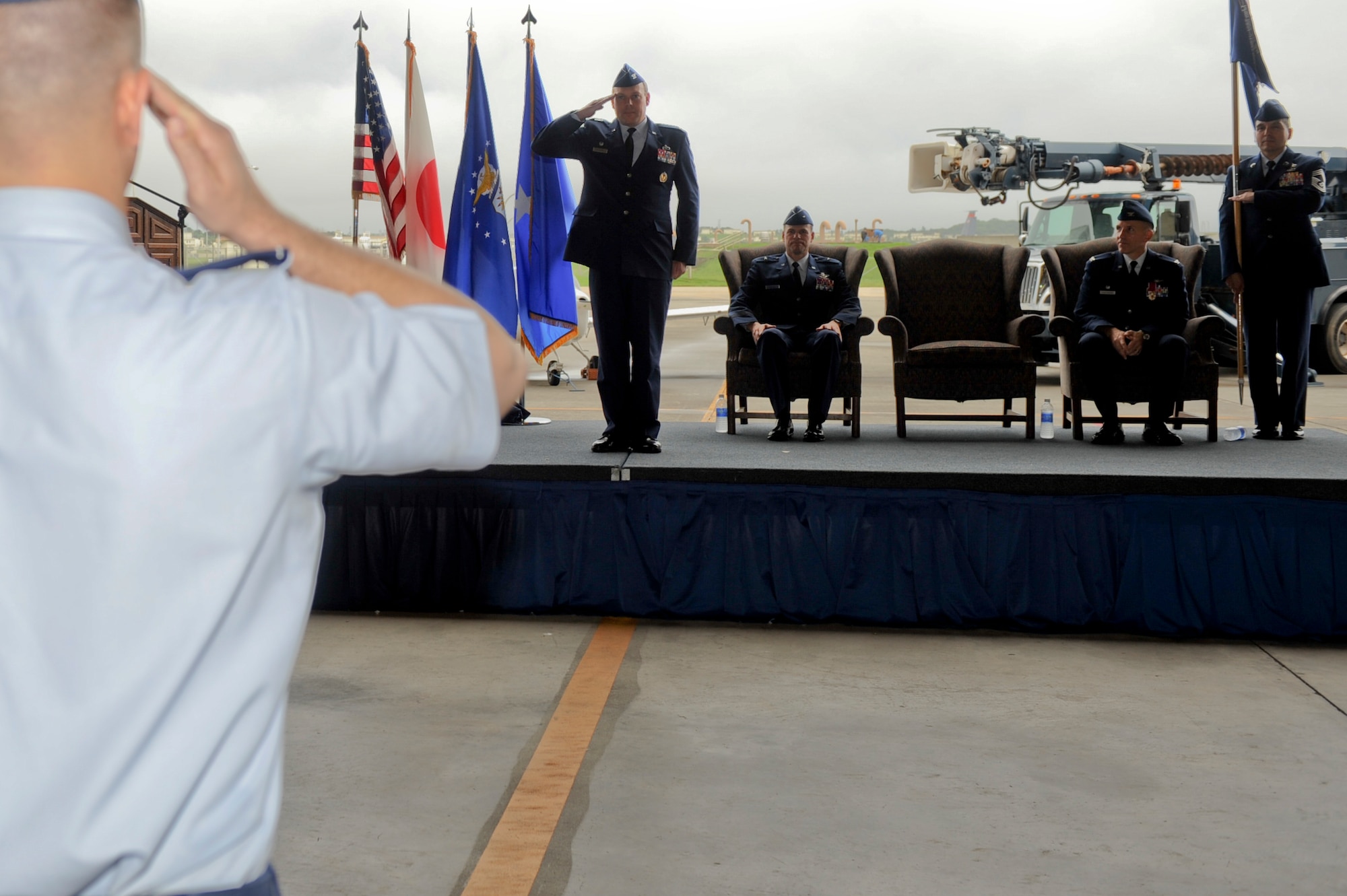 U.S. Air Force Col. Jeffrey Ullmann, newly appointed commander of the 18th Mission Support Group, renders his first salute to the 18th MSG during a change of command ceremony on Kadena Air Base, Japan, July 18, 2012. The 18th MSG consists of five squadrons that offers security, services, contracting, communications, logistics readiness and force management support for 25,000 people.