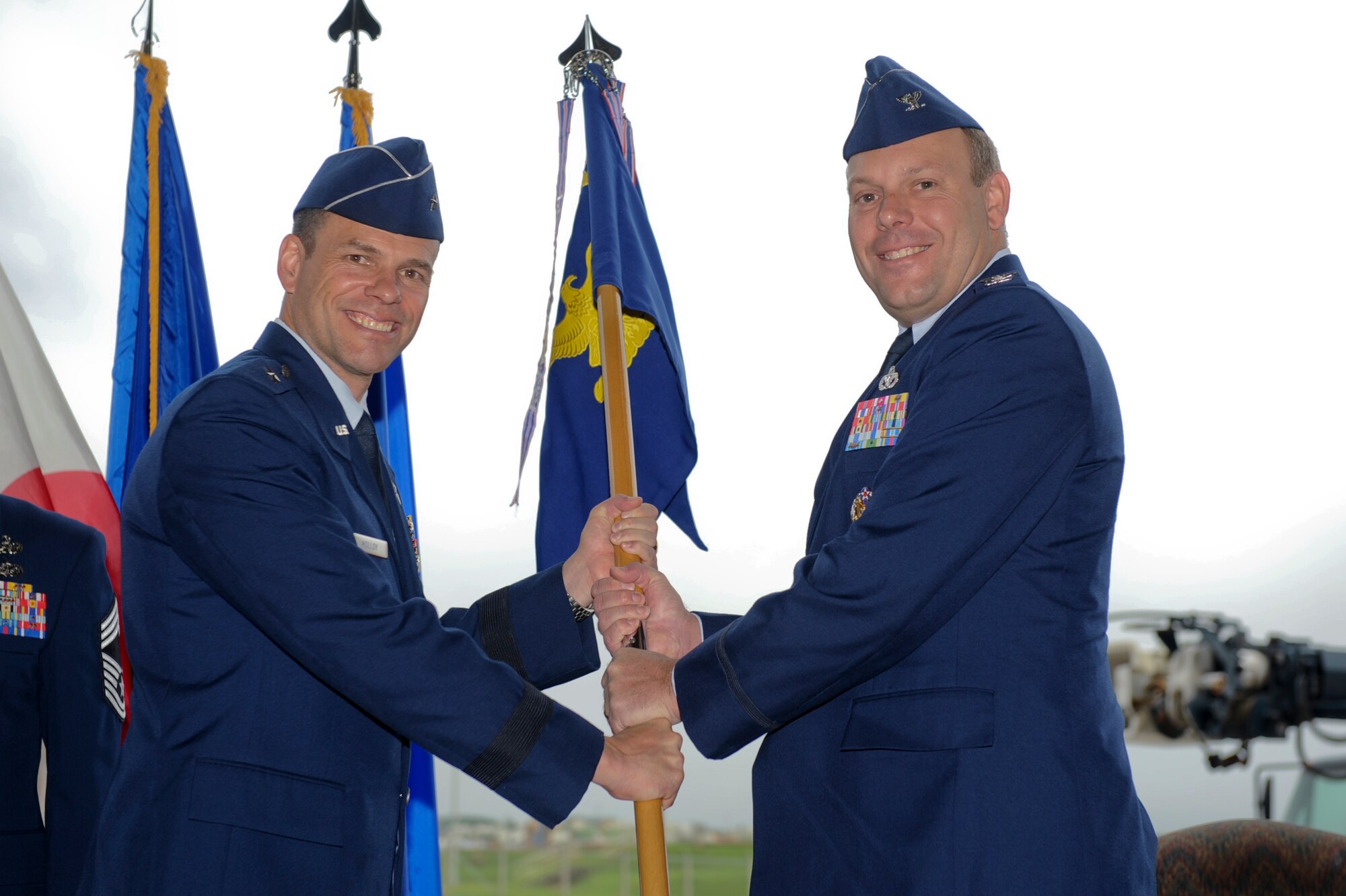 U.S. Air Force Col. Jeffrey Ullmann, newly appointed commander of the 18th Mission Support Group, accepts the guidon during a change of command ceremony on Kadena Air Base, Japan, July 18, 2012. The 18th MSG provides combat support for Pacific Air Forces' largest installation with 18th Wing and associate units, $6 billion in assets and more than 12,500 acres. (U.S. Air Force photo/Airman 1st Class Brooke P. Beers)