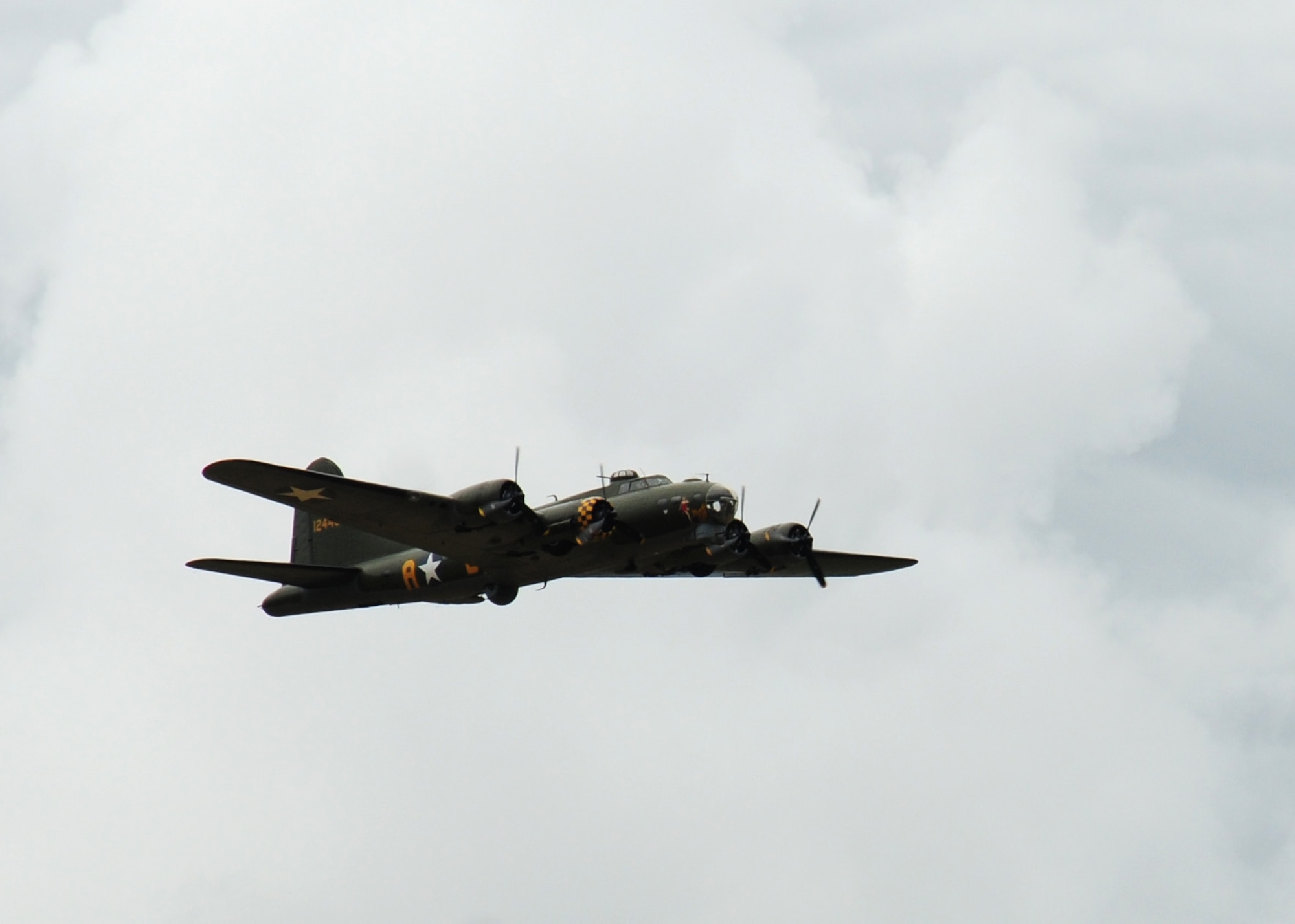 CONEY WESTON, England -- The last active B-17 Flying Fortress in Europe performs a fly-over above the former Knettishall Airfield July 14, 2012. The fly-over was part of the 388th Bombardment Group memorial re-dedication at Coney Weston.  The memorial is dedicated to the Airmen who lost their lives while serving in the 388th BG at Knettishall Airfield. (U.S. Air Force Photo by Staff Sgt. Megan P. Lyon)
