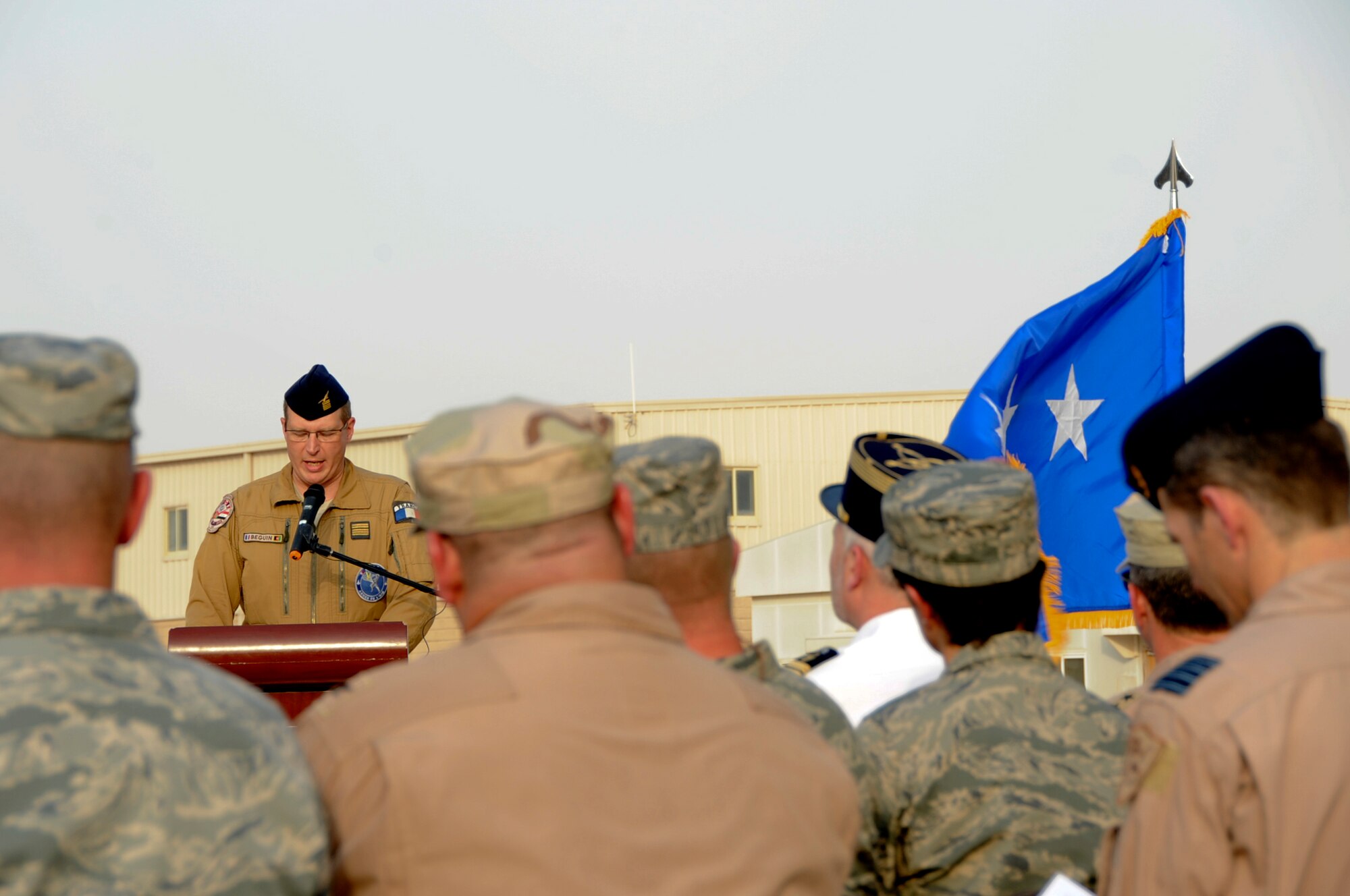 French Colonel Xavier Beguin, French Air Force Commander Afghanistan, spoke to the audience during the French National day in Southwest Asia, July 14, 2012. The French National day was established by law in 1880 when the royal jail ?La Bastille? was captured. Commanders from six allied nations attended the ceremony in support of the event.  (U.S. Air Force photo/Staff Sgt. Sheila deVera)