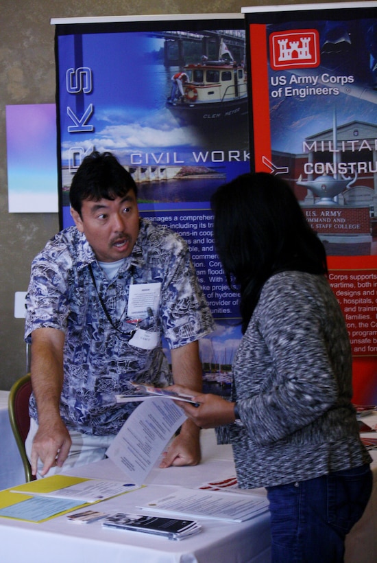 Honolulu District contracting officer Kent Tamai mans the District's booth during the 10th Annual DoD Hawai'i Small Business Forum held at the Honolulu Country Club on Thursday, July 12, 2012.