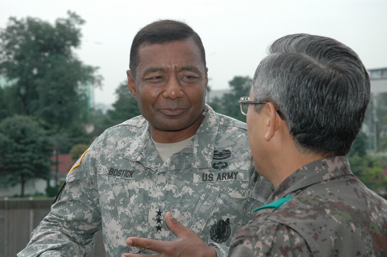 SEOUL, Republic of Korea – Lt. Gen. Thomas Bostick listens to Maj. Gen. Park Kye-su, director of the Republic of Korea Defense Installations Agency, as the two discuss various joint U.S. and Korean construction projects on the peninsula July 17.   Bostick, the Chief of U.S. Army Engineers and Commanding General of the U.S. Army Corps of Engineers, met with U.S. and Korean military officials and toured the multi-billion dollar construction project at U.S. Army Garrison Humphreys, about 40 miles south of Seoul. Bostick's visit to the Corps of Engineers Far East District in Korea was his first since assuming command May 22.  The Corps of Engineers has about 37,600 military and civilian personnel providing project management and construction support in more than 100 countries. U.S. Army photo by Jason Chudy.