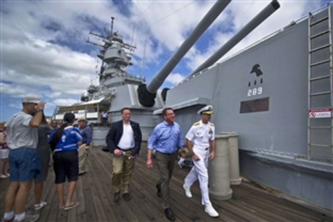 Navy Rear Adm. Robin M. Watters, U.S. Pacific Command chief of staff, escorts Deputy Defense Secretary Ashton B. Carter aboard the USS Missouri memorial in Pearl Harbor, Hawaii, July 18, 2012. Carter toured the memorial while also meeting with service members.