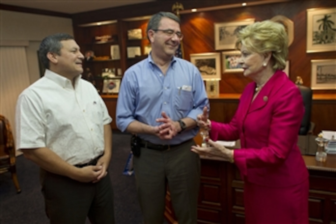 Deputy Secretary of Defense Ashton B. Carter visits with Guam Governor Eddie Baza Calvo, and Guam Rep. Madeleine Bordallo, on July 19, 2012.   Carter is also scheduled to meet with other Guamian leaders, tour U.S. military facilities, and discuss progress on new military construction.  The deputy secretary's stop in Guam is in the midst of a 10-day Asia-Pacific trip meeting partners in Japan, Thailand, India and South Korea.  