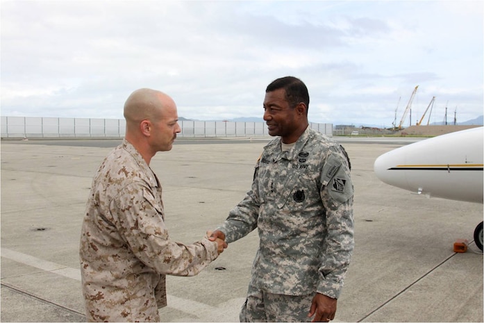 Lt. Col. Gordan J. Limb, station executive officer, greets Army Lt. Gen. Thomas P. Bostick, U.S. Army chief of Engineers and Corps of Engineers commanding general, as he exits his plane here July 19, 2012. Bostick came to the station to see first hand the extensive reconstruction undertaking here.