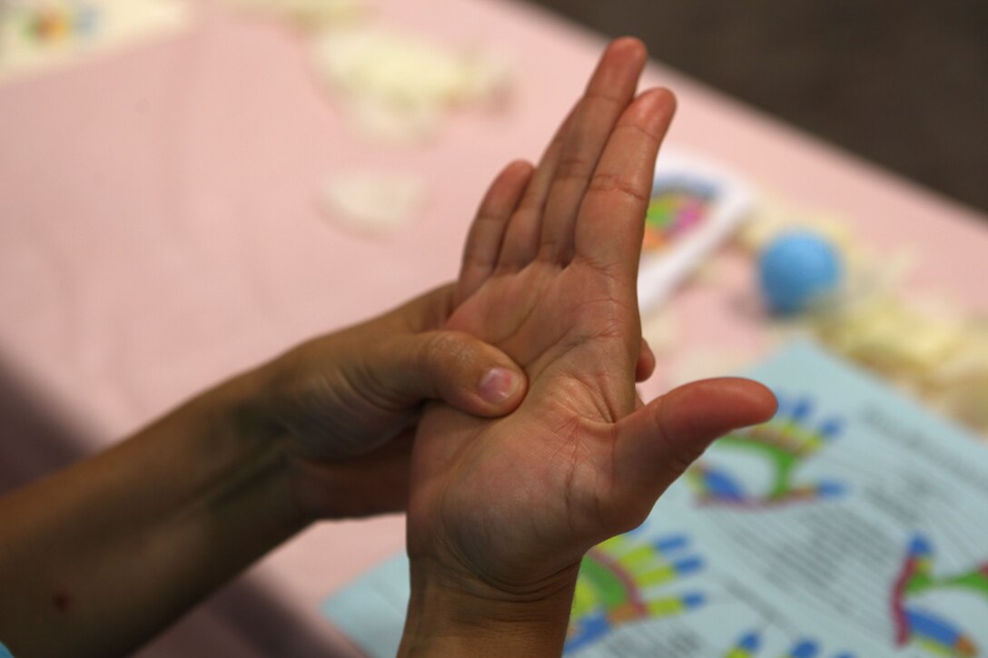 Participants learned reflexology techniques at the “It’s All About You,” mid-deployment workshop at the Russell Marine and Family Center aboard the base July 7. Reflexology involves using manual pressure on ones hands and feet to relieve problems throughout the body.  