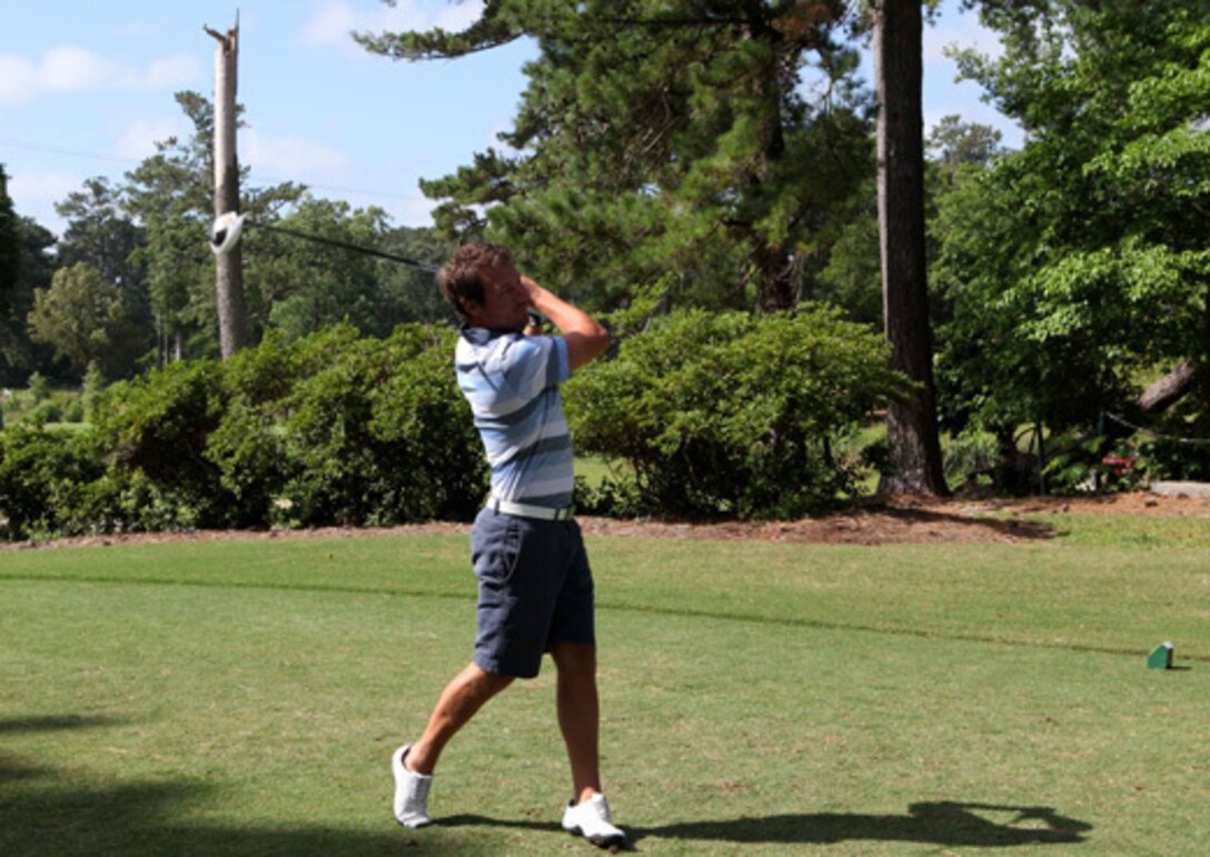 A golfer strikes the ball during the Military Heroes Golf Classic June 15 at the Jacksonville Country Club. The event was a part of a series of fundraisers that includes a gala later in the year.


