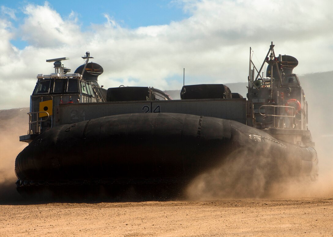 A Landing Craft Air Cushion (LCAC) carrying Marine High Mobility Multi-Purpose Wheeled Vehicles (or â€œHumveesâ€) arrives at Kawaihae Port from USS Essex (LHD 2) during the schedule of events phase, Rim of the Pacific 2012, July 18. Marine and Navy logisticians disembarked vehicles, equipment and supplies here from amphibious shipping in support of a fire support coordination exercise at the Pohakuloa Training Area. Twenty-two nations, more than 40 ships and submarines, more than 200 aircraft and 25,000 personnel are participating in RIMPAC exercise from June 29 to Aug. 3, in and around the Hawaiian Islands. The world's largest international maritime exercise, RIMPAC provides a unique training opportunity that helps participants foster and sustain the cooperative relationships that are critical to ensuring the safety of sea lanes and security on the world's oceans. RIMPAC 2012 is the 23rd exercise in the series that began in 1971.