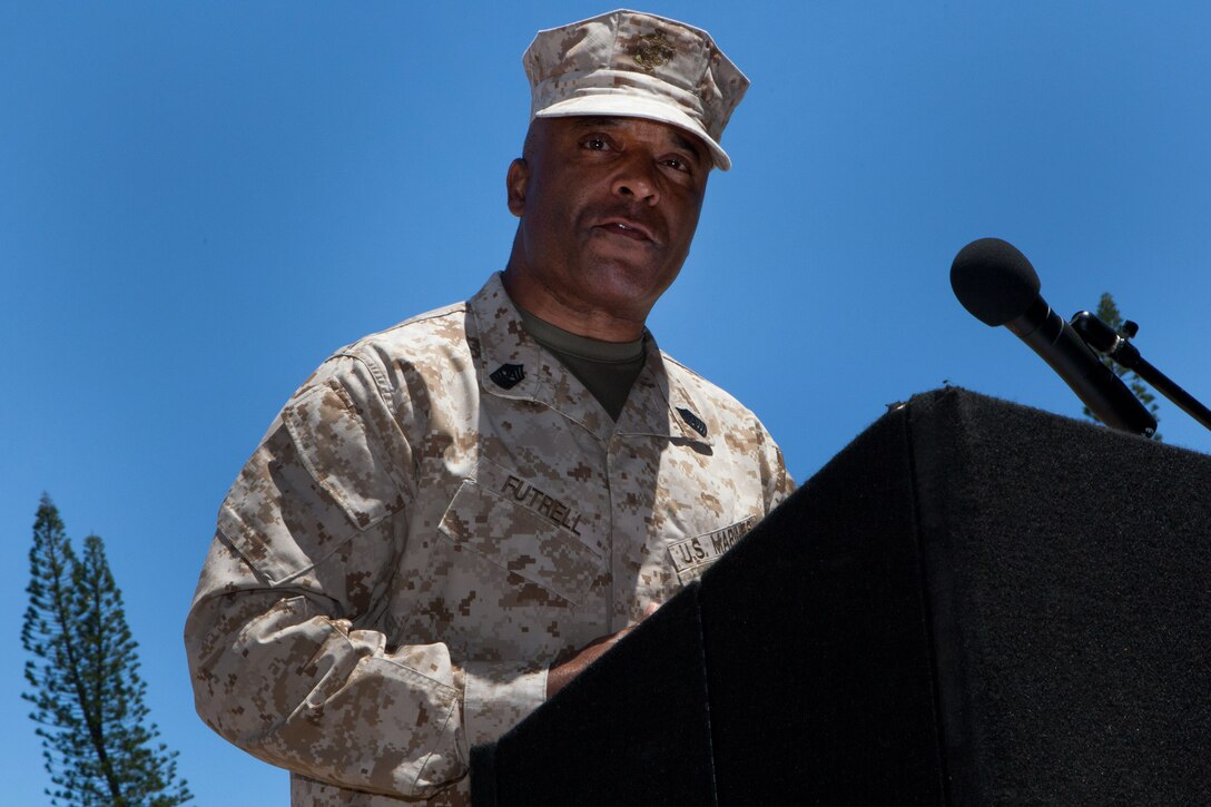 Sgt. Maj. James R. Futrell, U.S. Marine Corps Forces, Pacific sergeant major, delivers a farewell speech during the relief, appointment and retirement ceremony at Dewey Square here July 19. Futrell retired after 33 years of service, while Sgt. Maj. William T. Stables stepped in to carry on as the new force sergeant major.