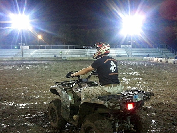 Staff Sgt. Steven McColl, 29, from Savage, Minn., prepares for an ATV soccer match at the Sherburne County Fairgrounds on July 20. McColl, a recruiter out of the Buffalo, Minn., office, was asked to participate by one of the Sherburne County Fair coordinators. Marines with RSS Buffalo were at the event hosting a fitness challenge.