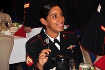 Cpl. Zugelly Perezsoto, 23, from Bronx, N.Y., proudly displays her dog tags to avoid a fine at the Marine Wing Support Squadron 471 I&I staff mess night on July 20. Anyone who couldn't produce their dog tags had to pay a $2 fine, inlcuding the guest of honor Ret. Maj. Gen. Gordon C. Nash. For additional imagery from the event, visit www.facebook.com/rstwincities.