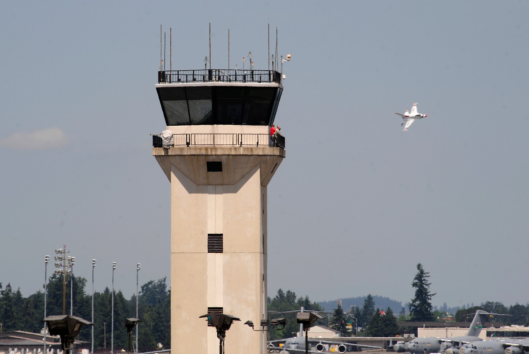 An F-16 Fighting Falcon with the U.S. Air Force Thunderbirds conducts a site survey of McChord Field prior to landing July 19, 2012, at Joint Base Lewis-McChord, Wash. The demonstration team will be one of the headliners for the 2012 Joint Base Lewis-McChord Air Expo. The air expo is open and free to the public. (U.S. Air Force photo/Adamarie Lewis-Page) 