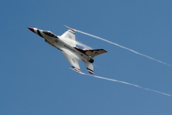 An F-16 Fighting Falcon with the U.S. Air Force Thunderbirds conducts a site survey of McChord Field prior to landing July 19, 2012, at Joint Base Lewis-McChord, Wash. The demonstration team will be one of the headliners for the 2012 Joint Base Lewis-McChord Air Expo. (U.S. Air Force photo/Adamarie Lewis-Page)
