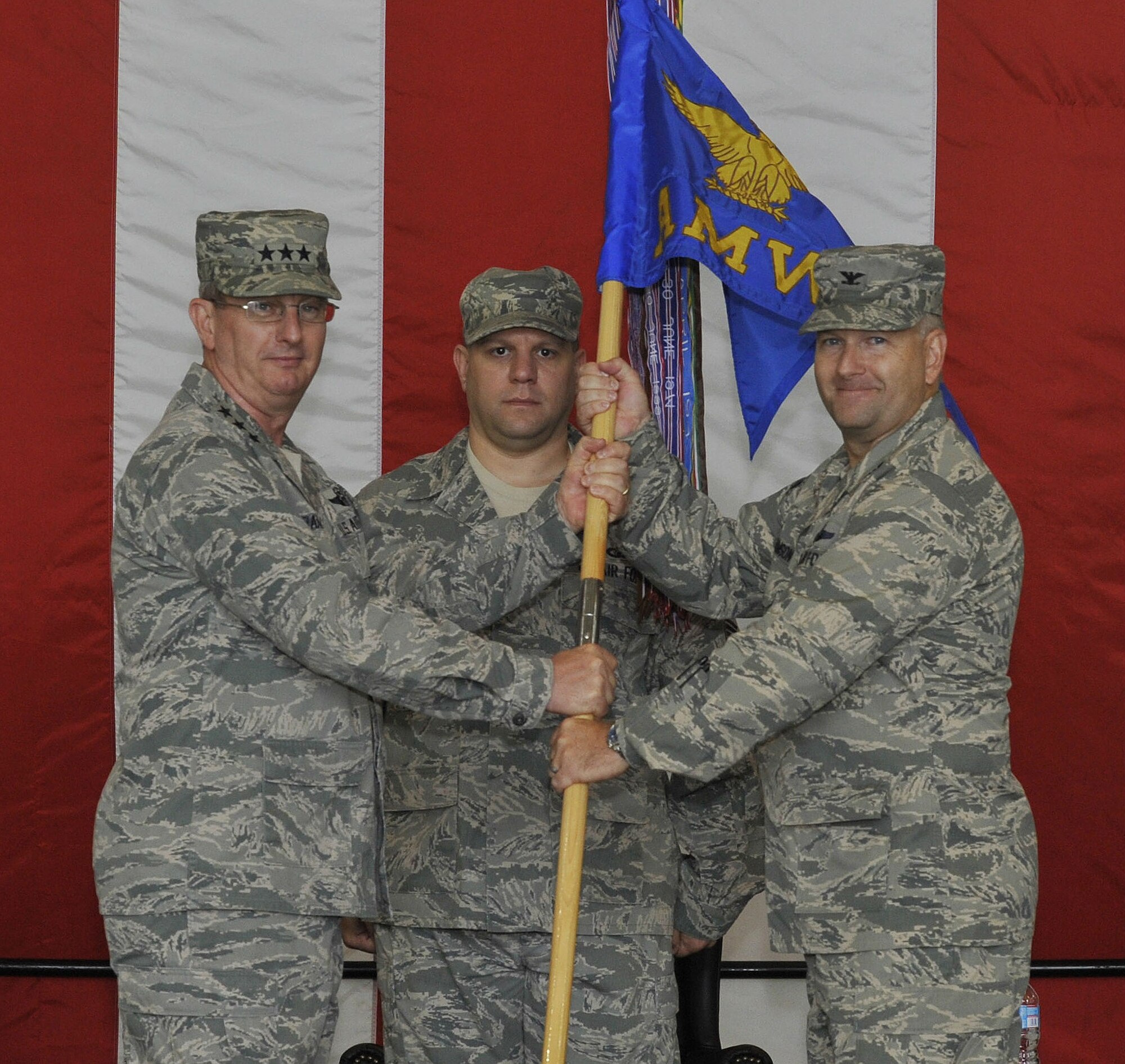 Lt. Gen. Mark Ramsay, 18th Air Force commander, passes the 305th Air
Mobility Wing guidon to Col. Richard Williamson Jr. during a 305th AMW
change of command ceremony July 20 here. Williamson assumed command from
Col. Paul Murphy who is leaving Joint Base McGuire-Dix-Lakehurst to serve as
Air Mobility Command's director of safety. Williamson came to JB MDL after
serving as the vice commander of the 60th AMW at Travis Air Force Base,
Calif. (U.S. Air Force photo by Wayne Russell/Released)