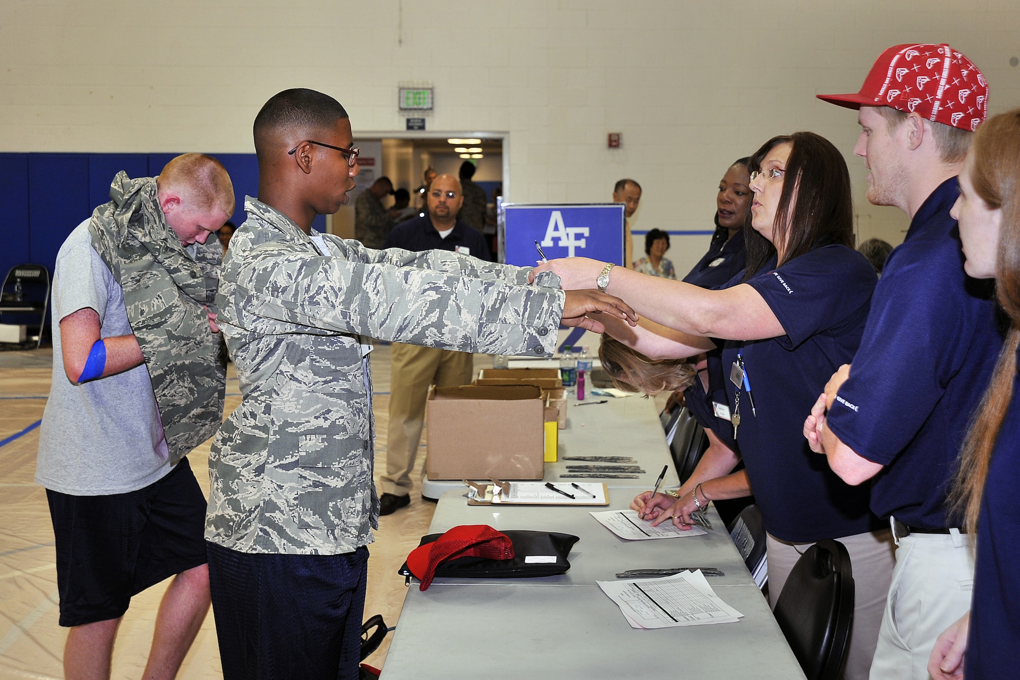 Cadets get fitted for uniforms during inprocessing at the Air Force Academy Preparatory School July 18. (U.S. Air Force Photo/Raymond McCoy)