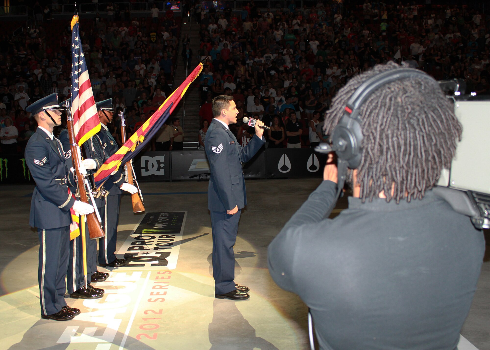 944th Fighter Wing Newcomer, Staff Sgt. Rickie Rosales, dental assistant, 944th Medical Squadron, brings big talent to the Phoenix West Valley. The NCO has toured the world as a professional vocalist and here, he opens the Street League Extreme Skateboarding competition at Jobing.com Arena in Glendale, Ariz., July 14, near Luke Air Force Base. (U.S. Air Force Photo by Tech. Sgt. Meredith Mingledorff) 