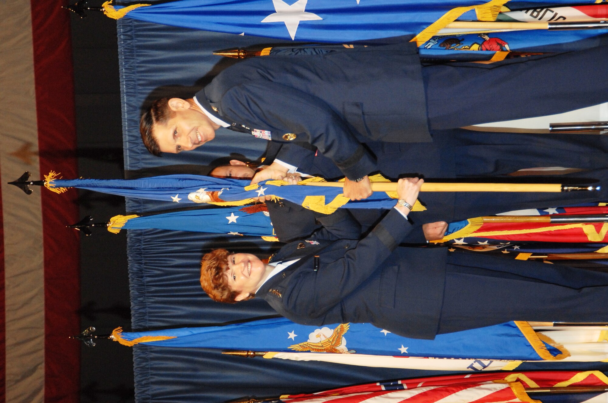 Lt. Gen C.D. Moore II receives the unit flag for the Air Force Life Cycle Management Center from AFMC Commander Gen. Janet Wolfenbarger during a ceremony officially recognizing the activation of the center on July 20.  