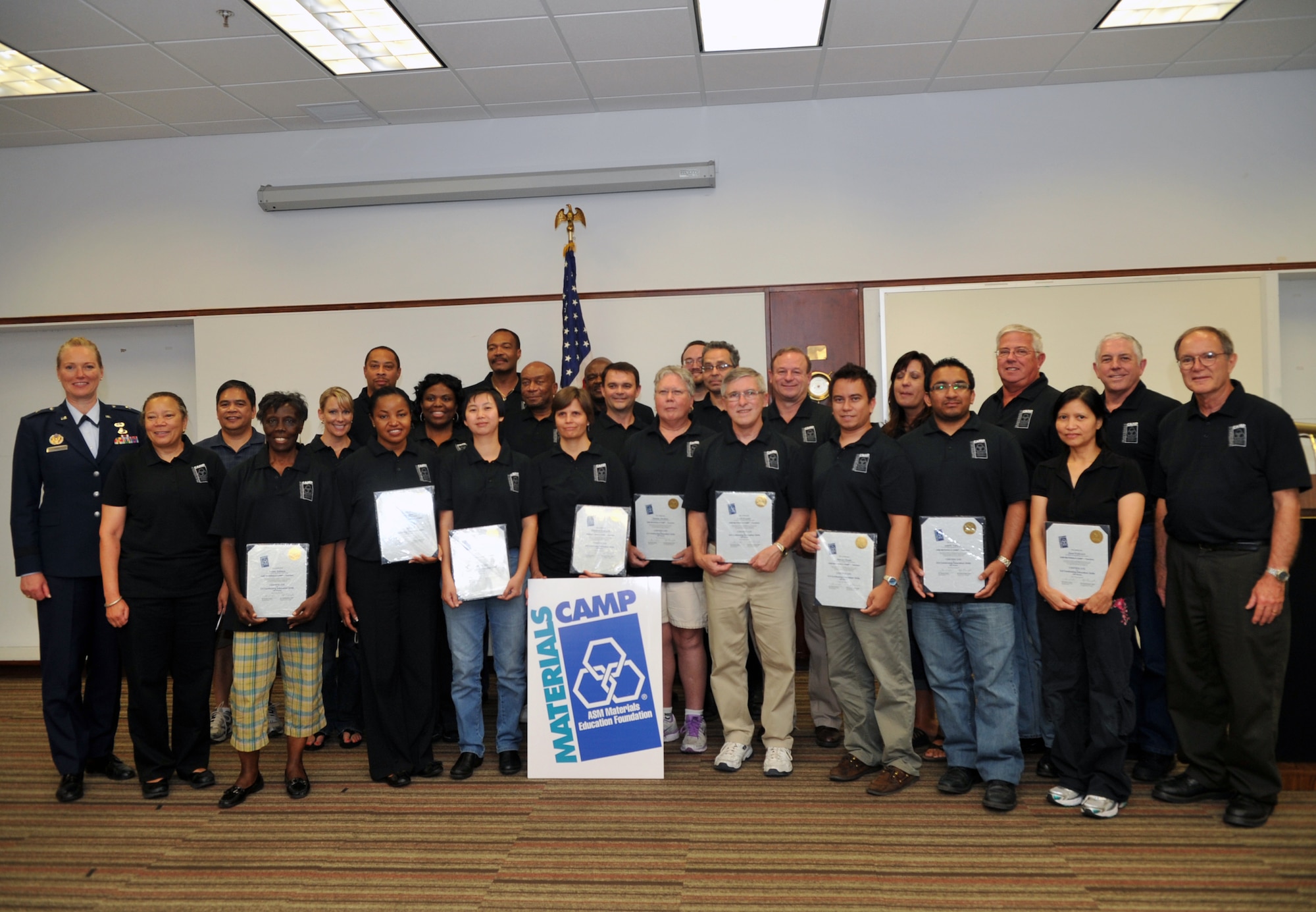 Brig. Gen. Jocelyn Seng (far left), mobilization assistant to the military deputy, office of the assistant secretary of the Air Force acquisition, poses with graduates of the ASM International Materials Camp who benefited from the Air Force-sponsored camp at Howard University in Washington, D.C., July 13.  Camp graduates included teachers and JROTC instructors from throughout the country. ASM International, Howard University and the U.S. Air Force partnered to make the camp possible. (U.S Air Force photo by 1st Lt. Ashleigh Peck)