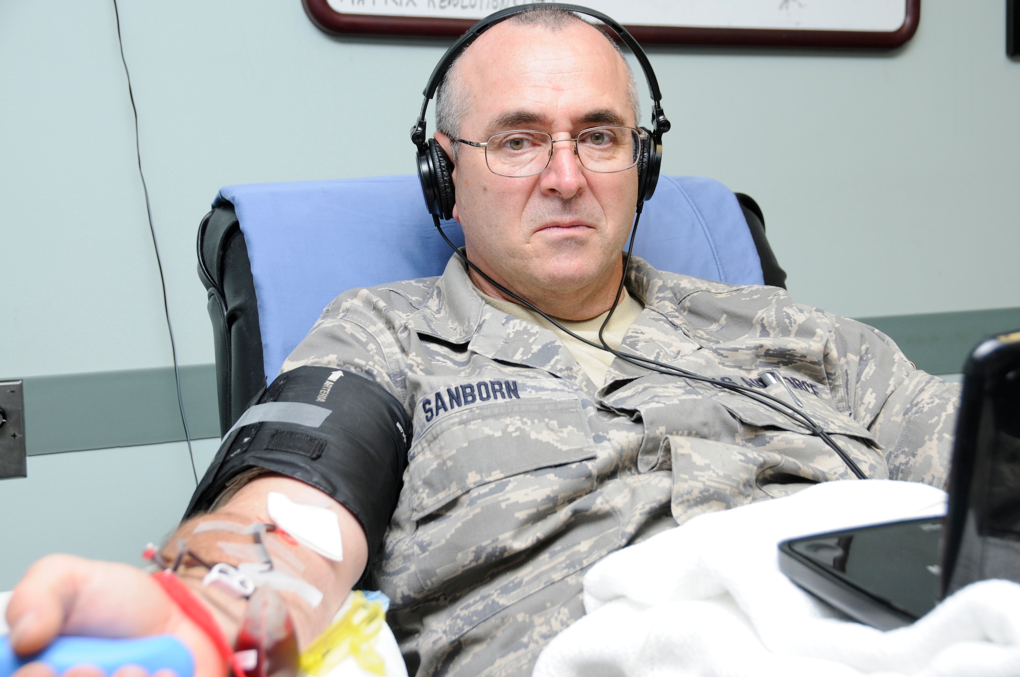 Senior Master Sgt. Craig Sanborn squeezes a stress ball to get the blood flowing at the American Red Cross Center in Burlington, Vt., July 18, 2012. A single donation of blood platelets can give up to three therapeutic doses to patients. (U.S. Air Force photo/Senior Airman Victoria Greenia)