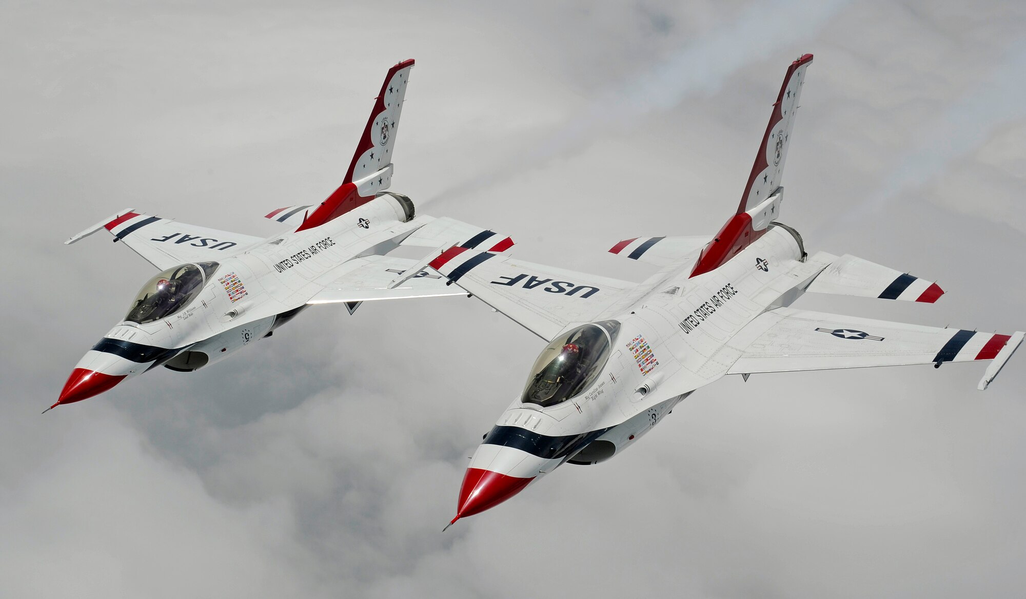 Two F-16 Fighting Falcons with the U.S. Air Force Aerial Demonstration Squadron Thunderbirds fly alongside a KC-135 Stratotanker from Fairchild Air Force Base, Wash., prior to refueling, July 19, 2012. The Thunderbirds are making their way to the Joint Base Lewis-McChord Air Expo, July 21 to 22. (U.S. Air Force photo by Airman 1st Class Ryan Zeski)