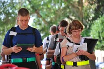 Trainees study their academic work while waiting in line to get necessary items at Maxwell July 3. Trainees are responsible to memorizing information that they study in any available down time. (U.S. Air Force photo by Airman 1st Class William Blankenship)