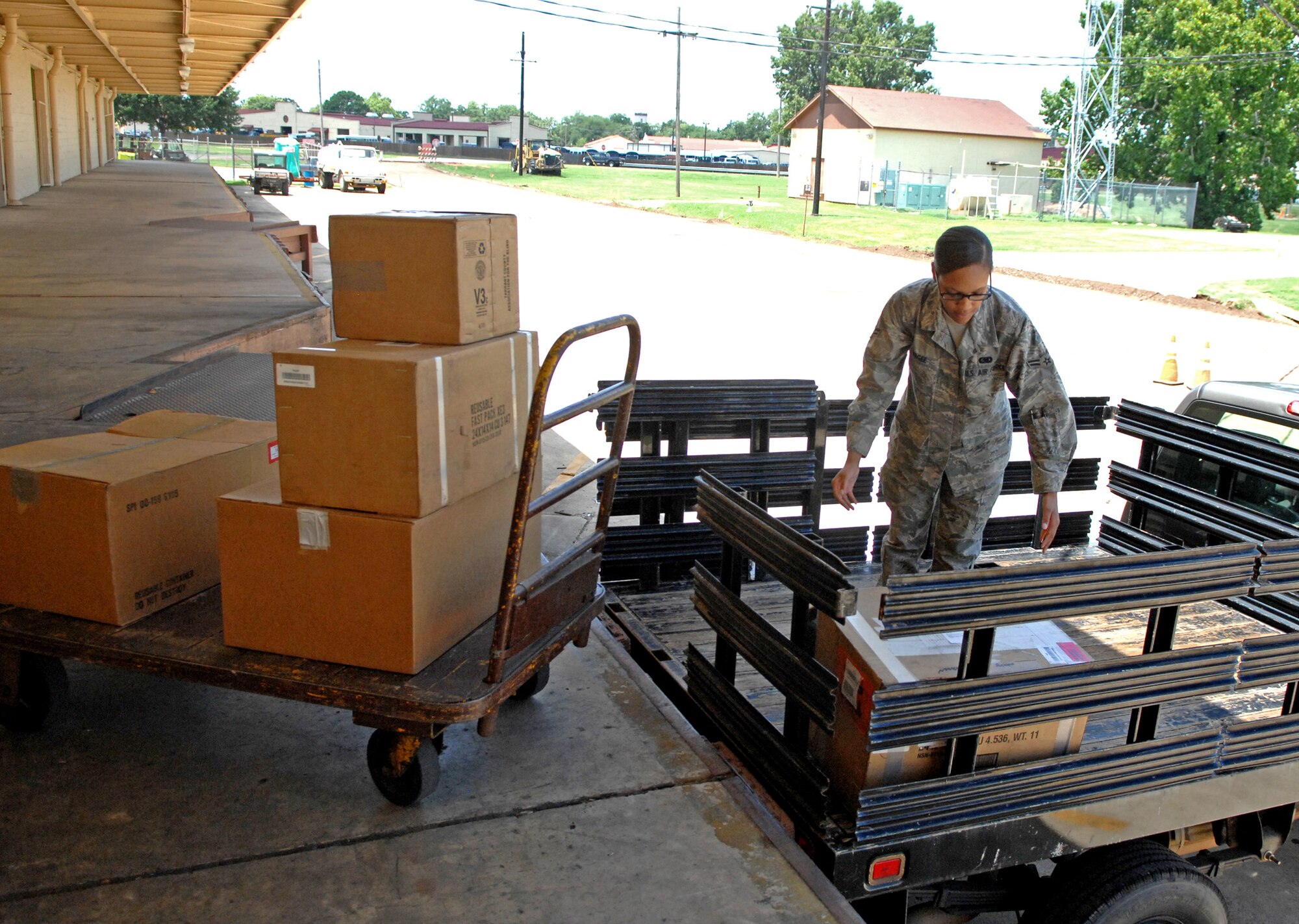 Airman 1st Class Gabrielle Magee, 2nd Logistics Readiness Squadron Aircraft Parts Store apprentice, picks up ordered parts at the main 2 LRS warehouse on Barksdale Air Force Base, La., July 18. The 24-hour APS stores more than 700 parts at the flightline warehouse for quick access to fix problems on the B-52H Stratofortress. (U.S. Air Force photo/Staff Sgt. Jason McCasland)(RELEASED)