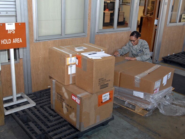 Airman 1st Class Gabrielle Magee, 2nd Logistics Readiness Squadron Aircraft Parts Store apprentice, inspects shipping labels for ordered parts at the main 2 LRS warehouse on Barksdale Air Force Base, La., July 18. The 24-hour APS stores more than 700 parts at the flightline warehouse for quick access to fix problems on the B-52H Stratofortress. (U.S. Air Force photo/Staff Sgt. Jason McCasland)(RELEASED)
