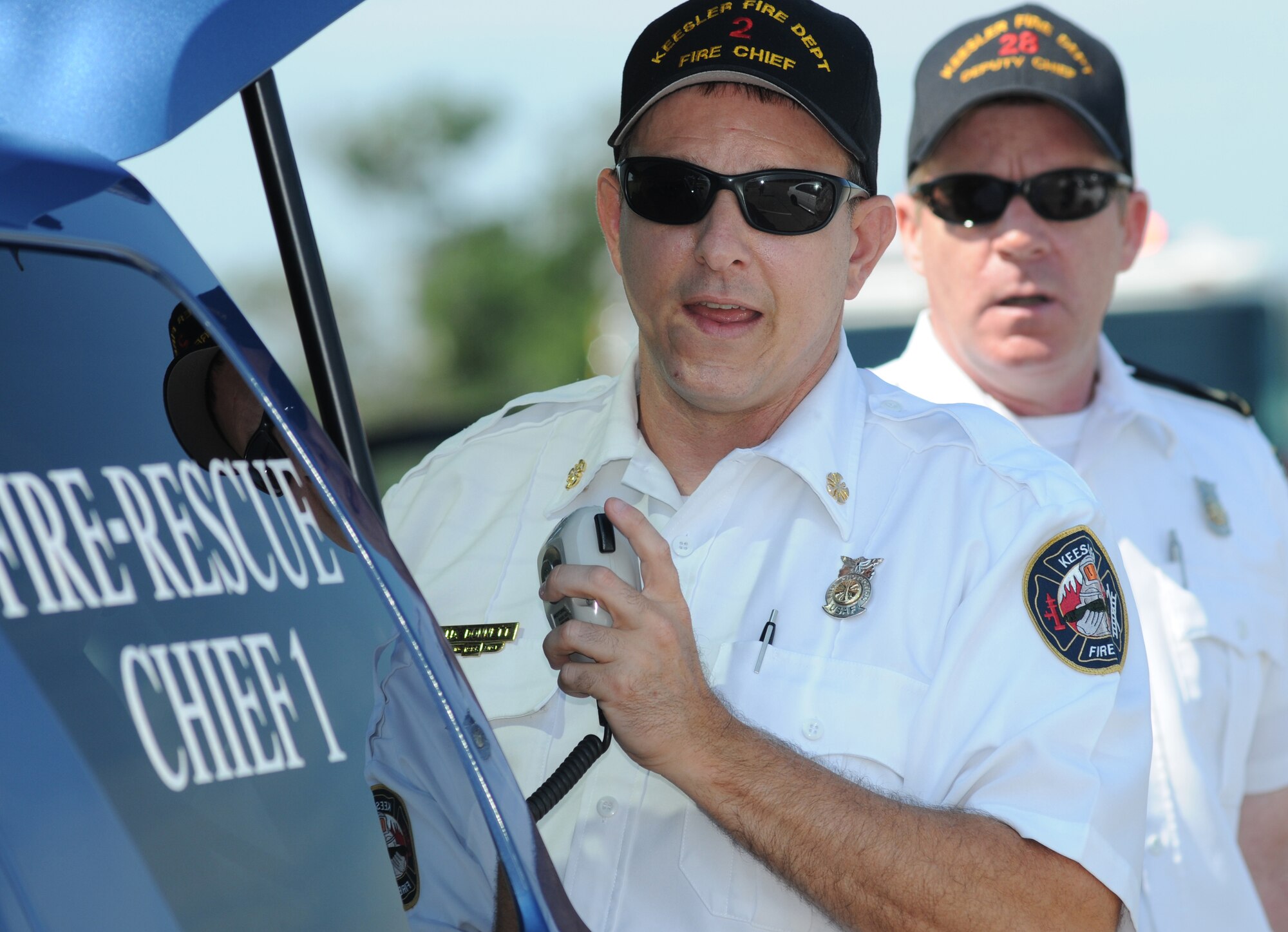 James Donnet, Keesler fire chief, and Gary Pierson, deputy fire chief, assess the scene during an exercise July 18, 2012, at Keesler Air Force Base, Miss.  Keesler held the three-day exercise to test the response of base personnel. In the exercise scenario, a disgruntled base employee sprayed harmful chemicals on Airmen in the Triangle training area injuring several people. Witnesses contacted 911 and within minutes, members of the 81st Security Forces Squadron apprehended the individual and first responders began decontamination and treatment of the victims. (U.S. Air Force photo by Kemberly Groue)