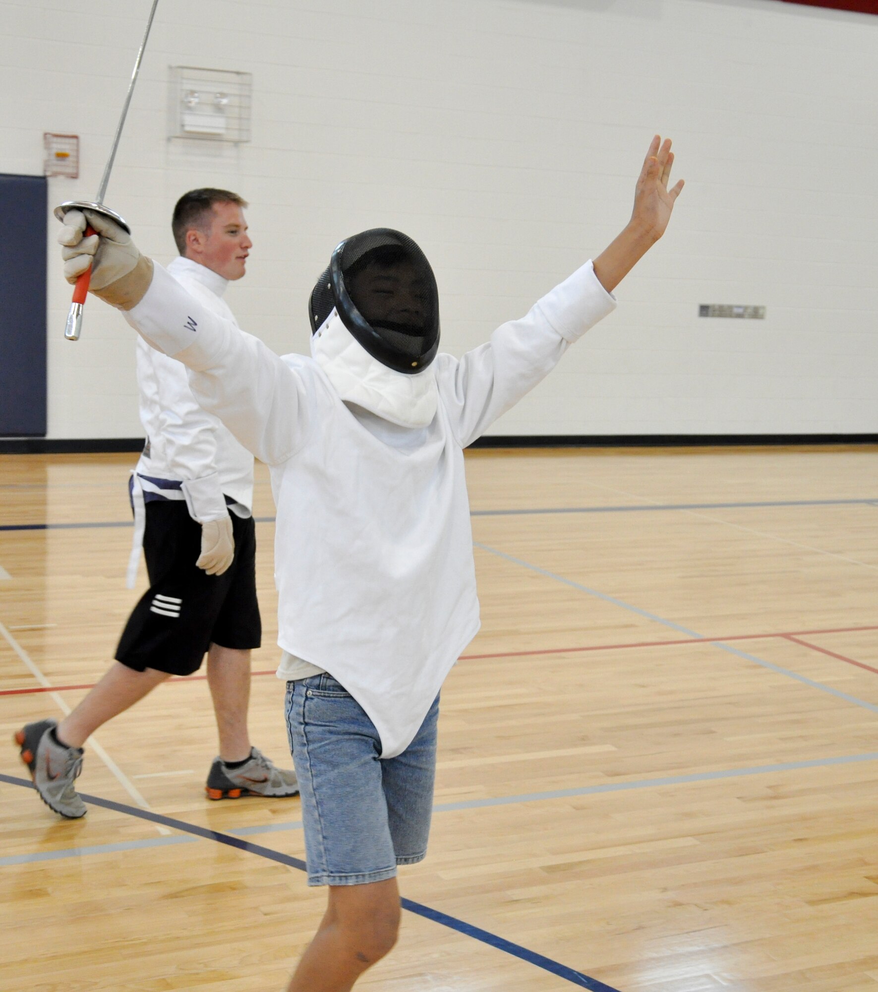 BUCKLEY AIR FORCE BASE, Colo. -- Daniel McMaster, celebrates after his fencing match July 18, at the Buckley Youth Center. Children were able to participate in unique sports throughout the week, other sports including lacrosse, hand ball and badminton. (U.S. Air Force photo by Staff Sgt. Nicholas Rau)