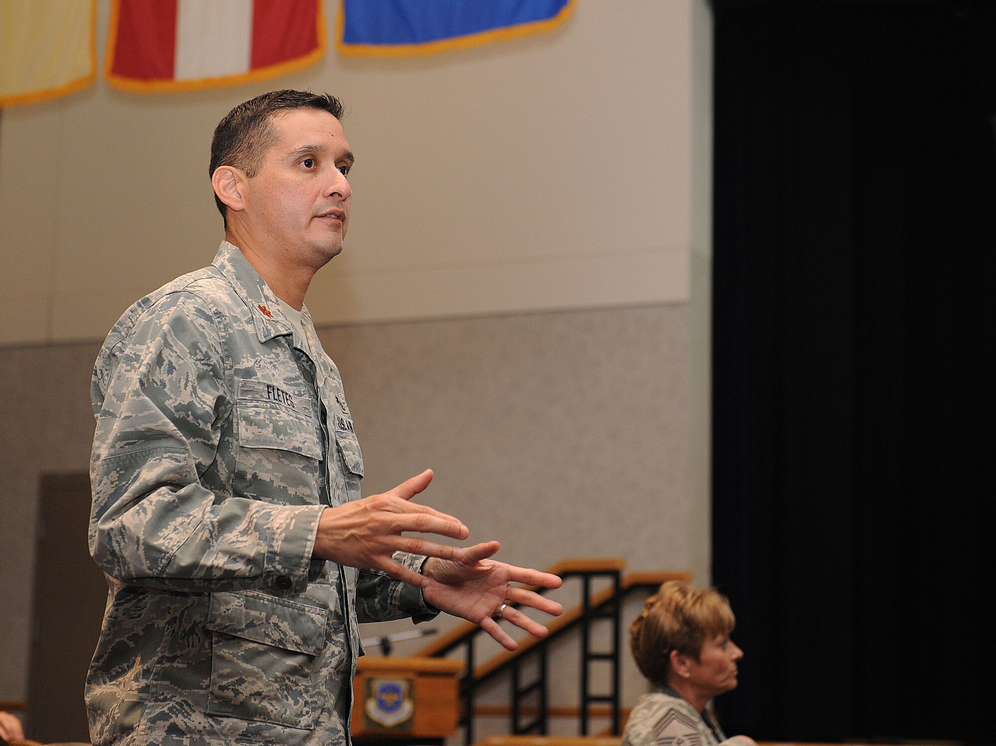 Maj. Marcio Fletes, 22nd Medical Support Squadron Diagnostics and Therapeutics Flight commander, speaks during the second quarter 22nd Medical Group forum July 19, 2012, McConnell Air Force Base, Kan. Fletes, along with other medical executives, explained questions that attendants had about TRICARE, the base pharmacy and anything else regarding the 22nd MDG.