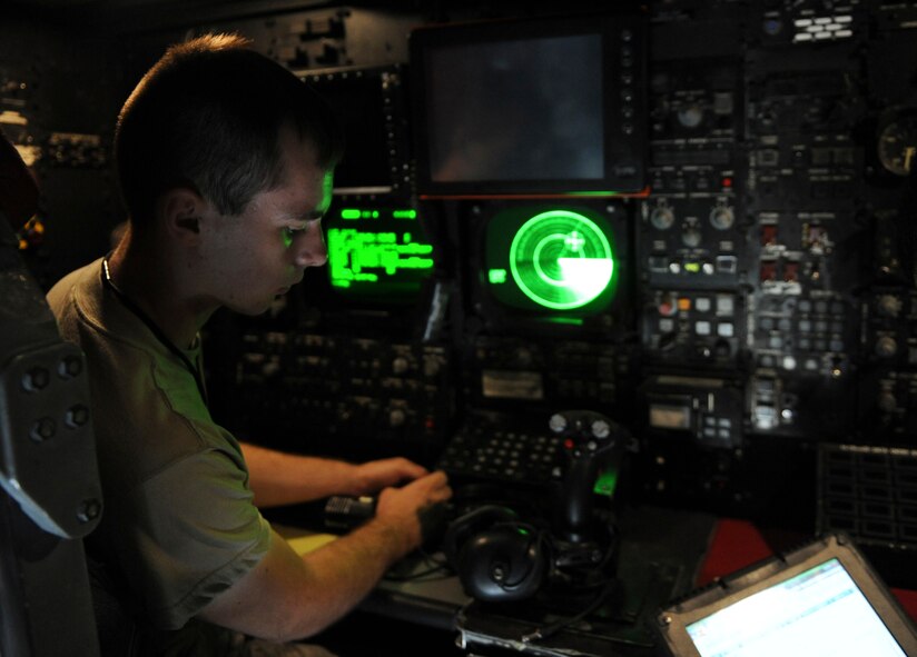 Airman 1st Class Trevor Hicks, 707th Maintenance Squadron, completes a step from the technical order for a B-52H Stratofortress bomber's offensive avionics system on Barksdale Air Force Base, La., July 20. The system provides aircrews with many capabilities, including evaluating the position of the aircraft from a fixed point, scanning weather and locating targets. (U.S. Air Force photo/Airman 1st Class Micaiah Anthony)(RELEASED)
